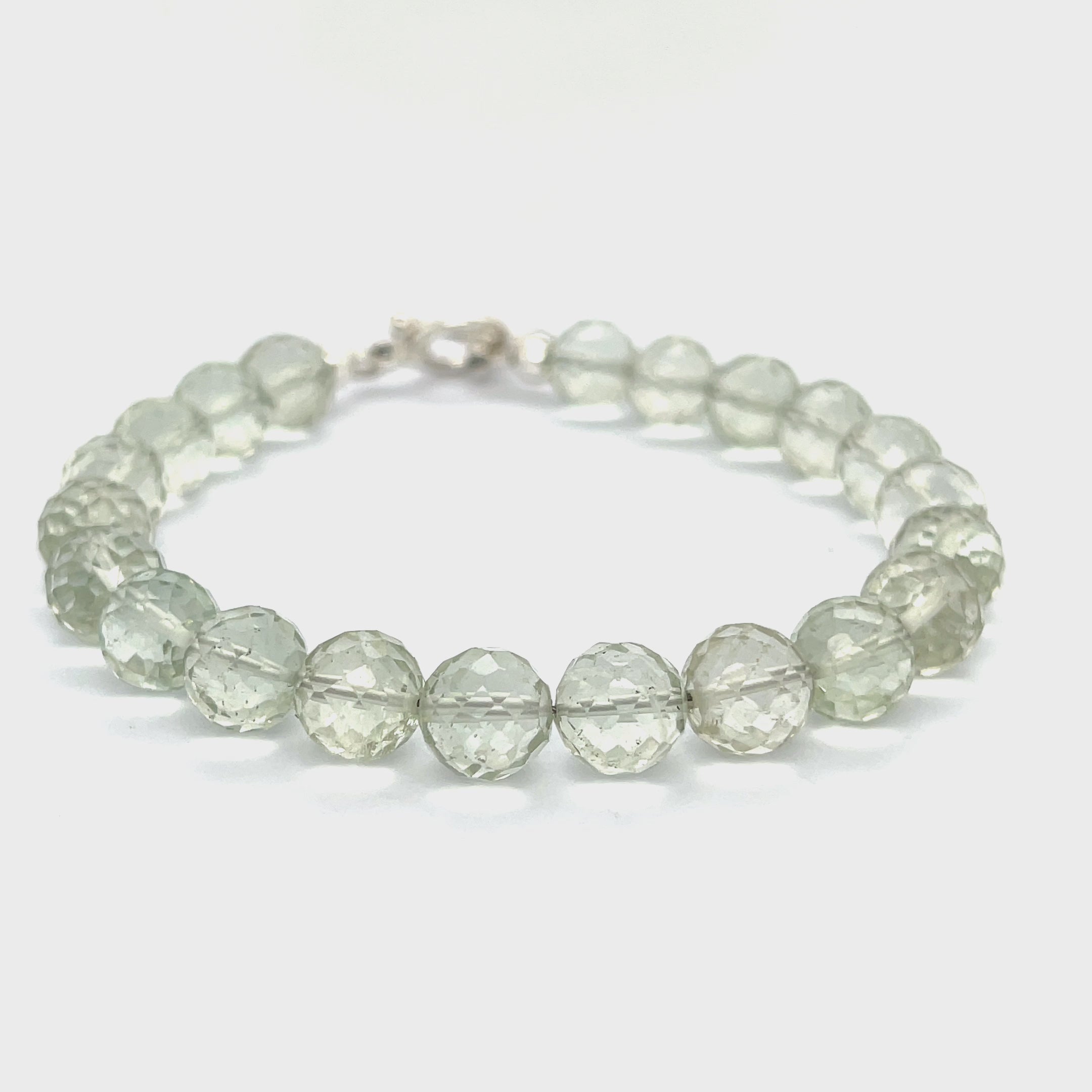 Handcrafted Prasiolite (Green Amethyst) gemstone bracelet with sterling silver toggle clasp by Hidden Jewel Boston on a white background front right angle overview video.