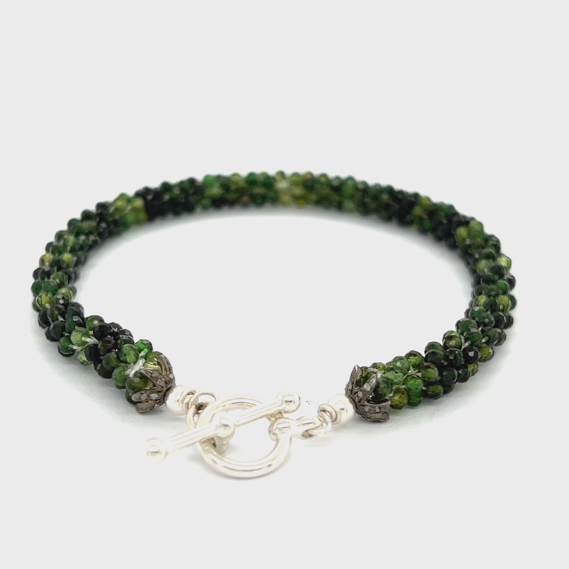 Emerald bracelet styled for everyday elegance or special occasions – a symbol of love and abundance. On a white background center overview. video
