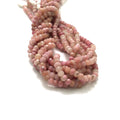 3mm Rhodochrosite faceted roundel gemstone strand on a white background, front overview.