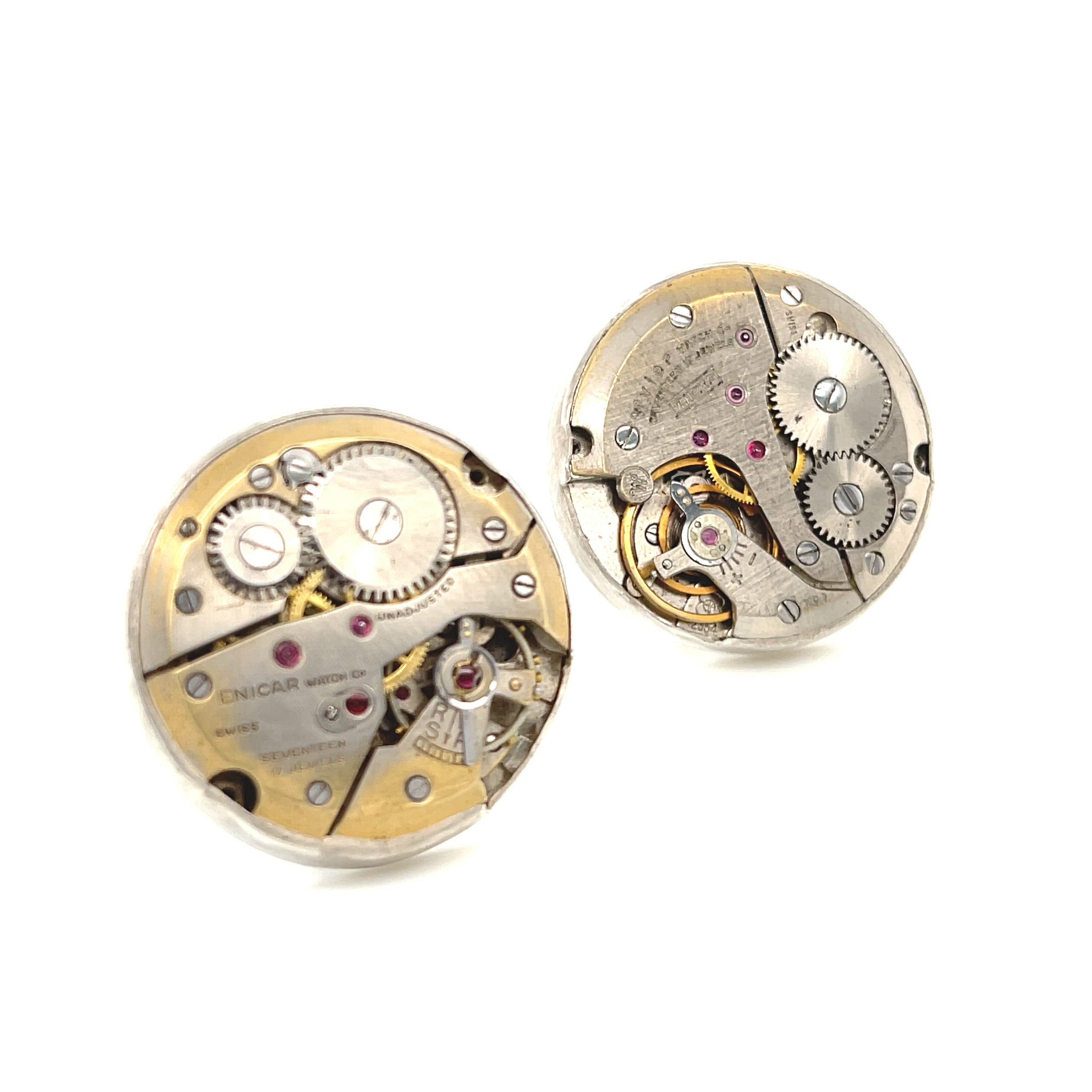 Handcrafted antique watch movement cuff links in sterling silver on a white background close up front view. video