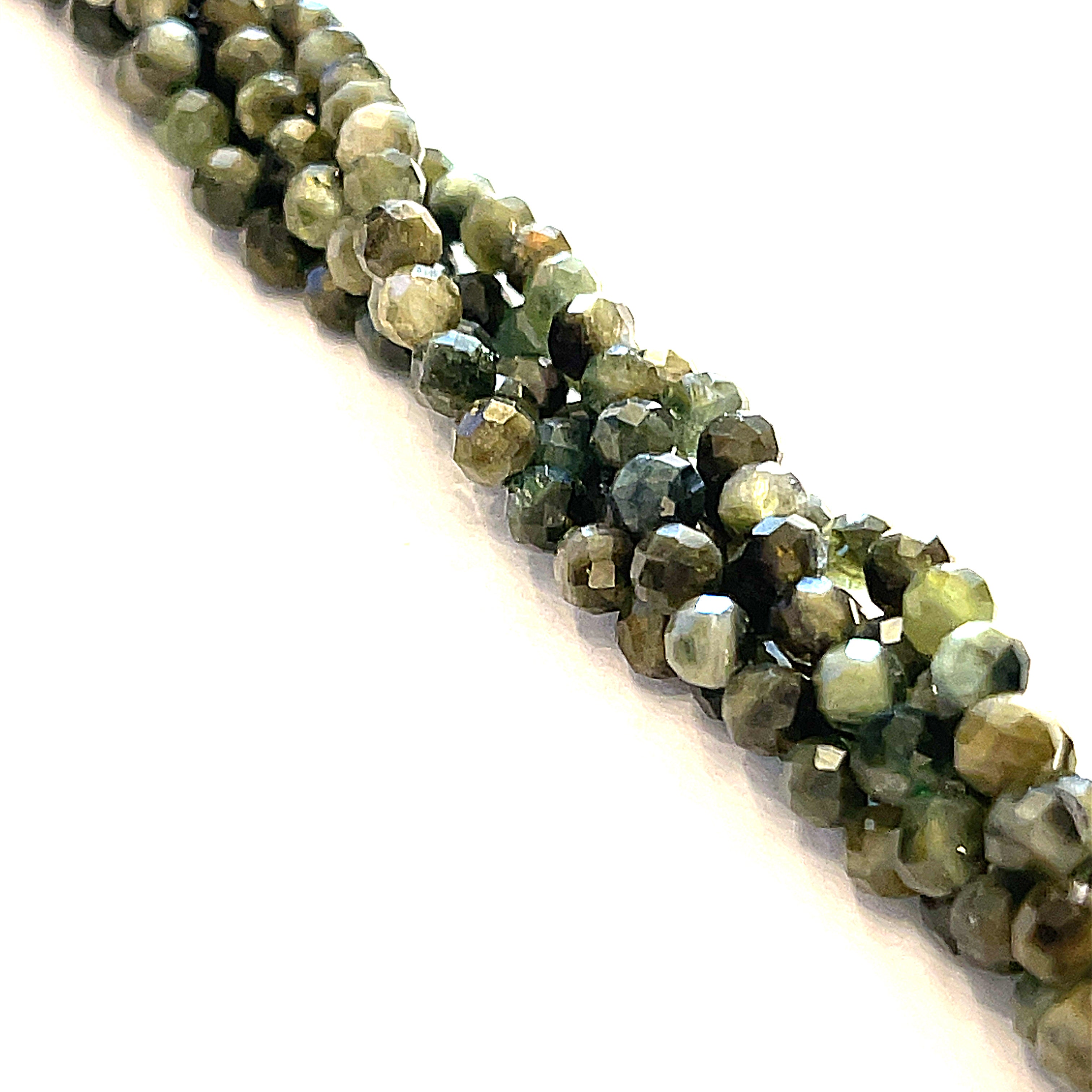4mm Green Tourmaline faceted round gemstone strand, on a white background, front view. 