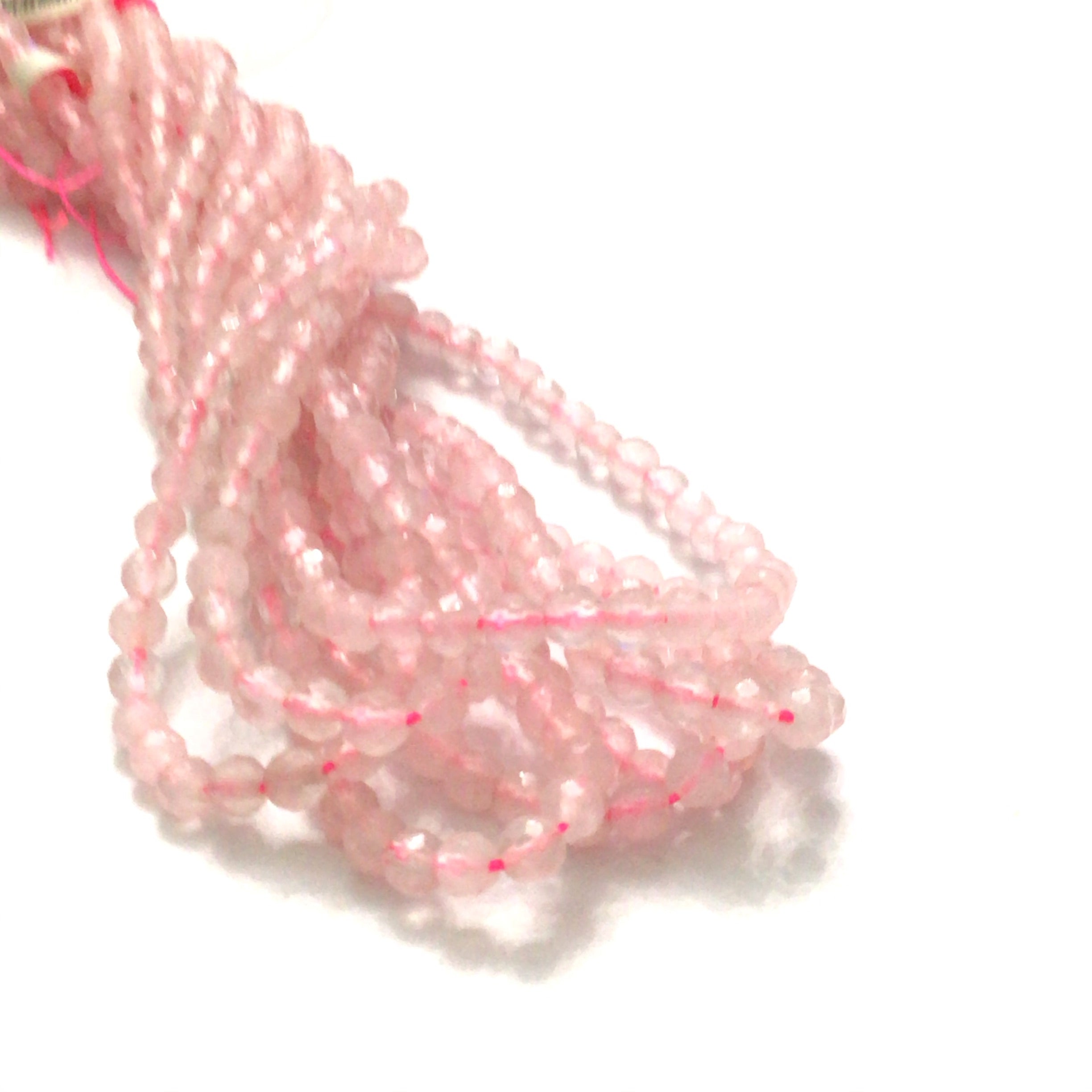 4mm Rose Quartz gemstone beads, faceted  round, 16'' strand on a white background, front overview.