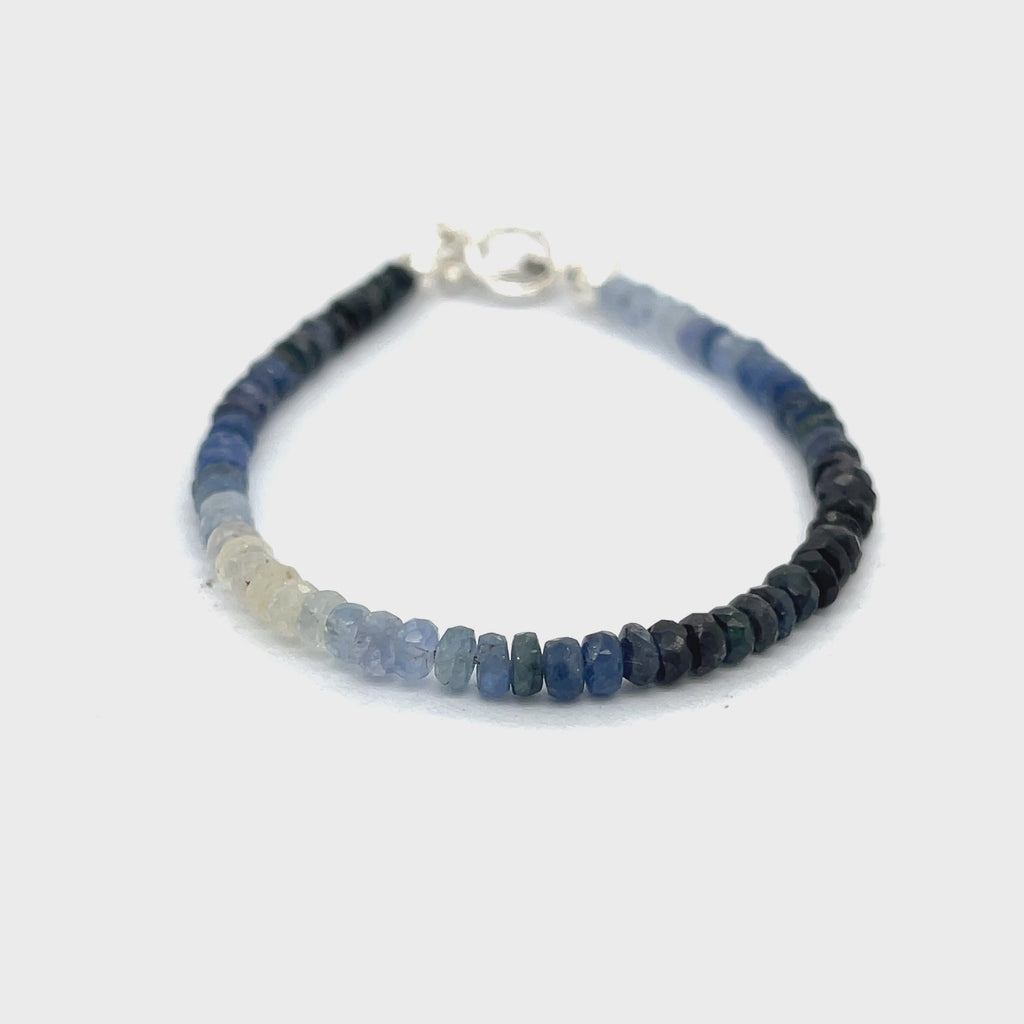 Genuine Sapphire gemstone bracelet with sterling silver toggle clasp by Hidden Jewel on a white background close up front overview video
