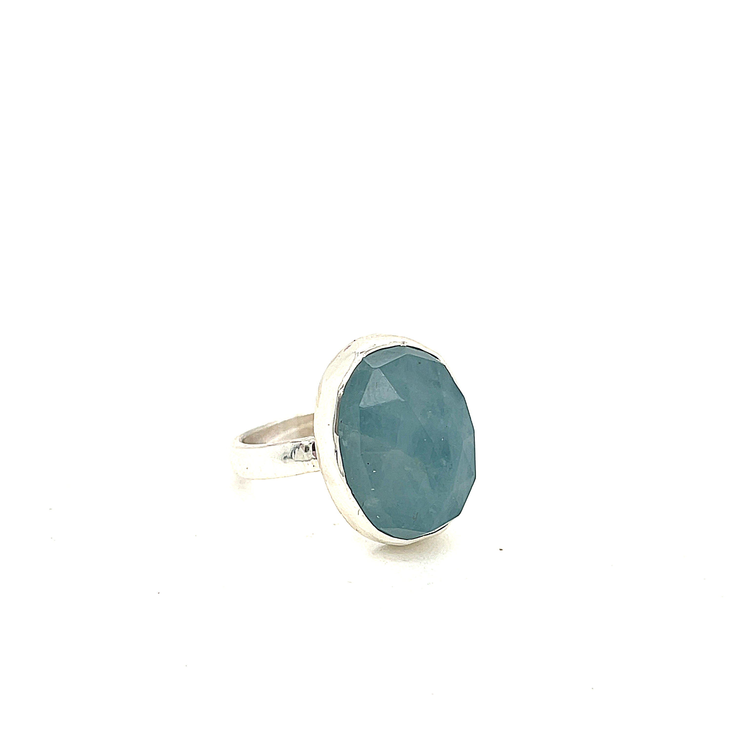 6ct faceted Aquamarine sterling silver ring — March birthstone jewelry  on a white background front right angle view. 