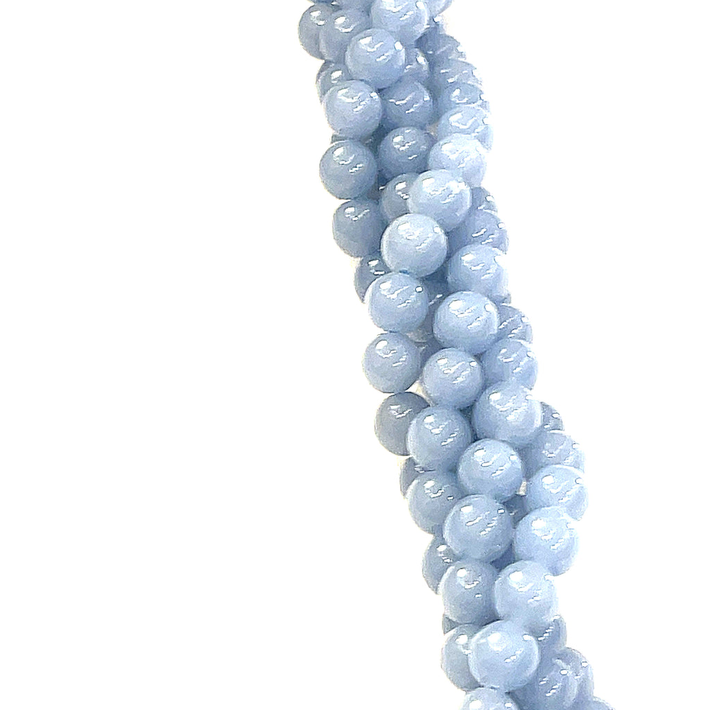 6mm Angelite smooth round gemstone strand, on a white background, front view. 