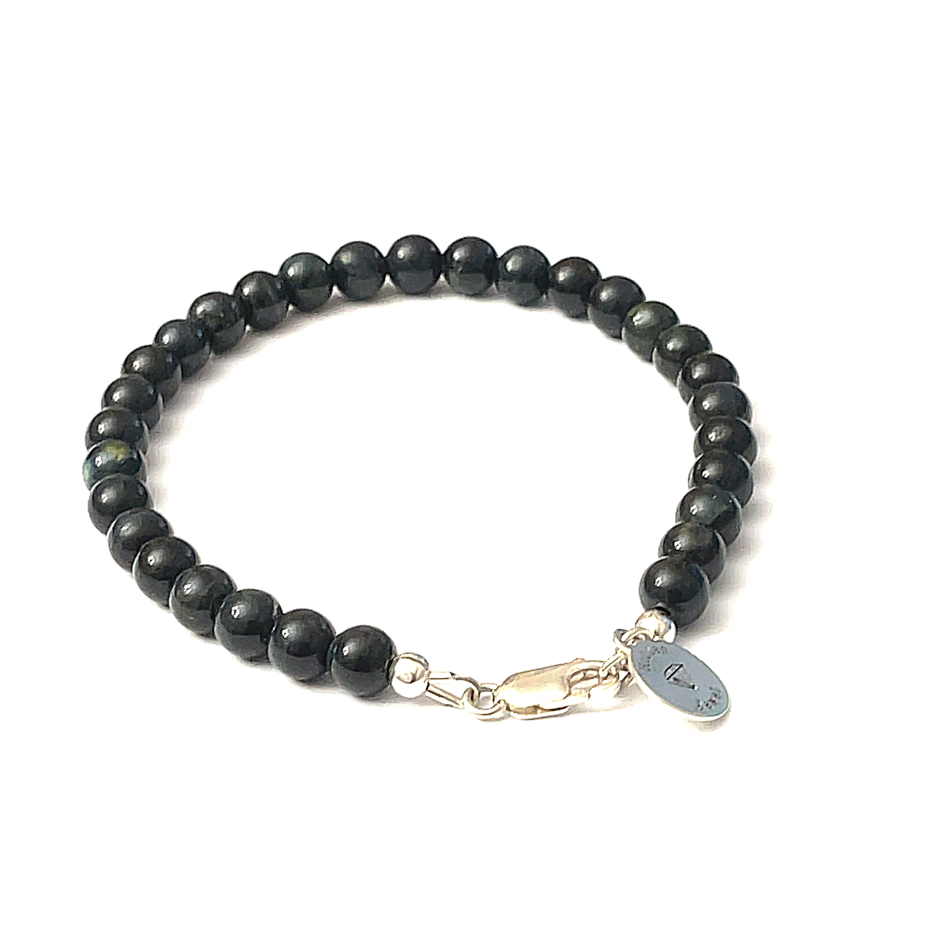 6mm Blue Tiger Eye gemstone beaded bracelet with sterling silver lobster claw clasp showing deep midnight blue chatoyant bands on a white background, back view. 