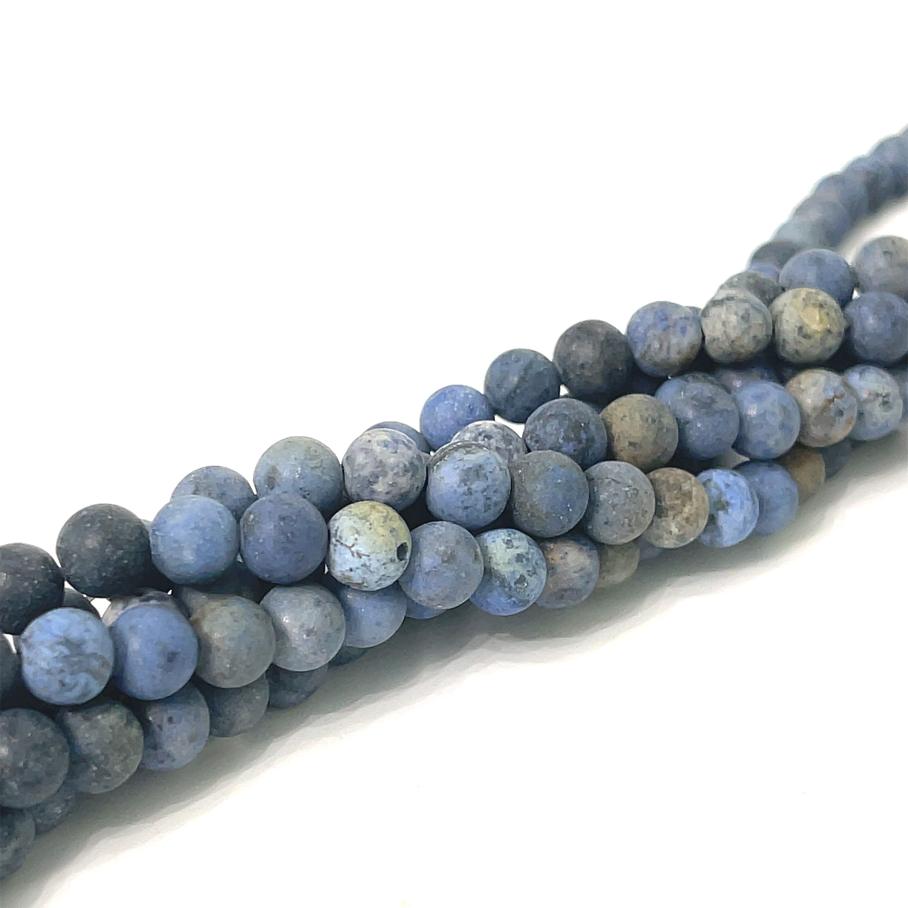 6mm Dumortierite smooth round matte gemstone strand, on a white background, front overview. 