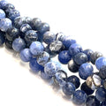 6mm Sodalite smooth round gemstone strand on a white background, front close up  overview.
