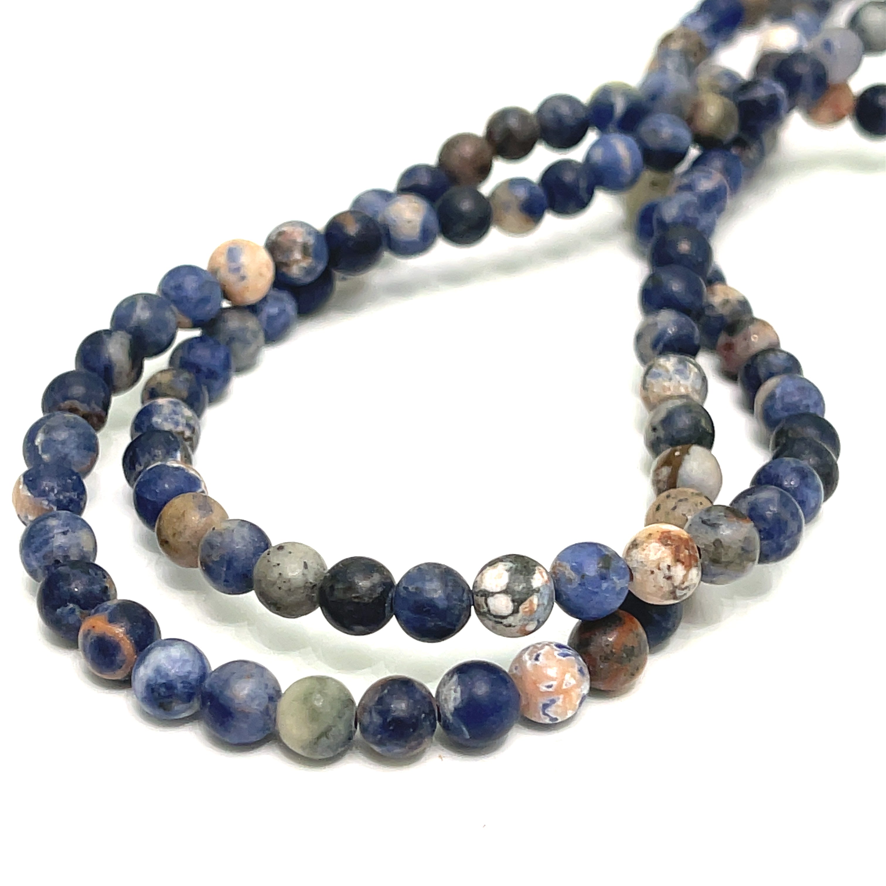 6mm Sodalite smooth round gemstone strand on a white background, front overview.