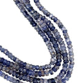 6mm faceted roundel Natural iolite gemstone strand in deep blue for third eye chakra activation and intuition on a white background, front over view. 