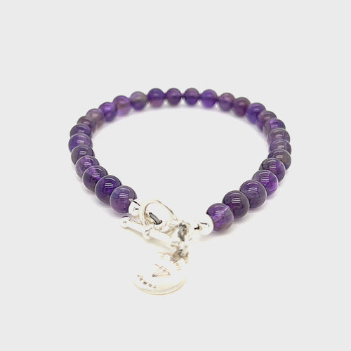 A beaded Amethyst gemstone bracelets, displayed against a white background, toggle overview. video