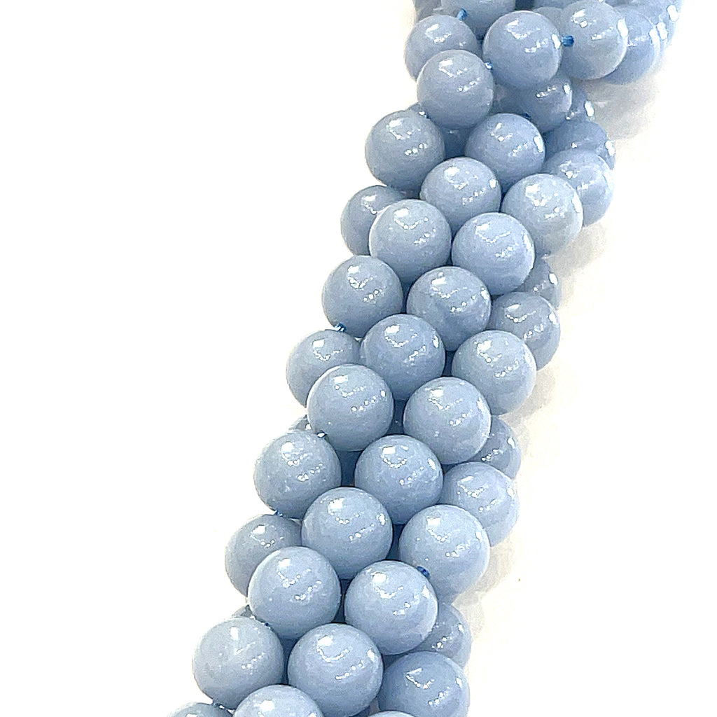 8mm Angelite smooth round gemstone strand, on a white background, front view. 
