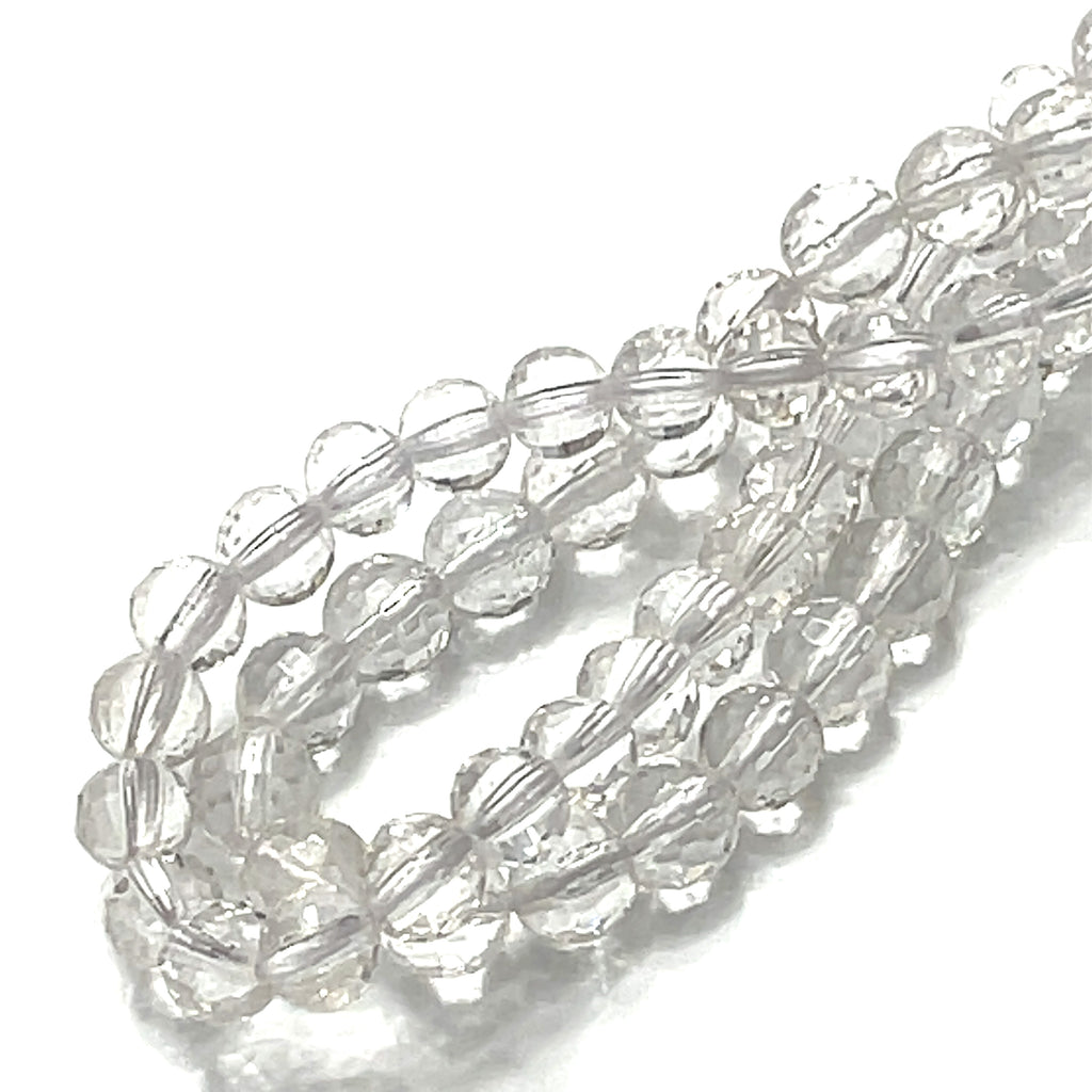 8mm Clear Quartz gemstone faceted cur rounds strand on a white background, overview. 