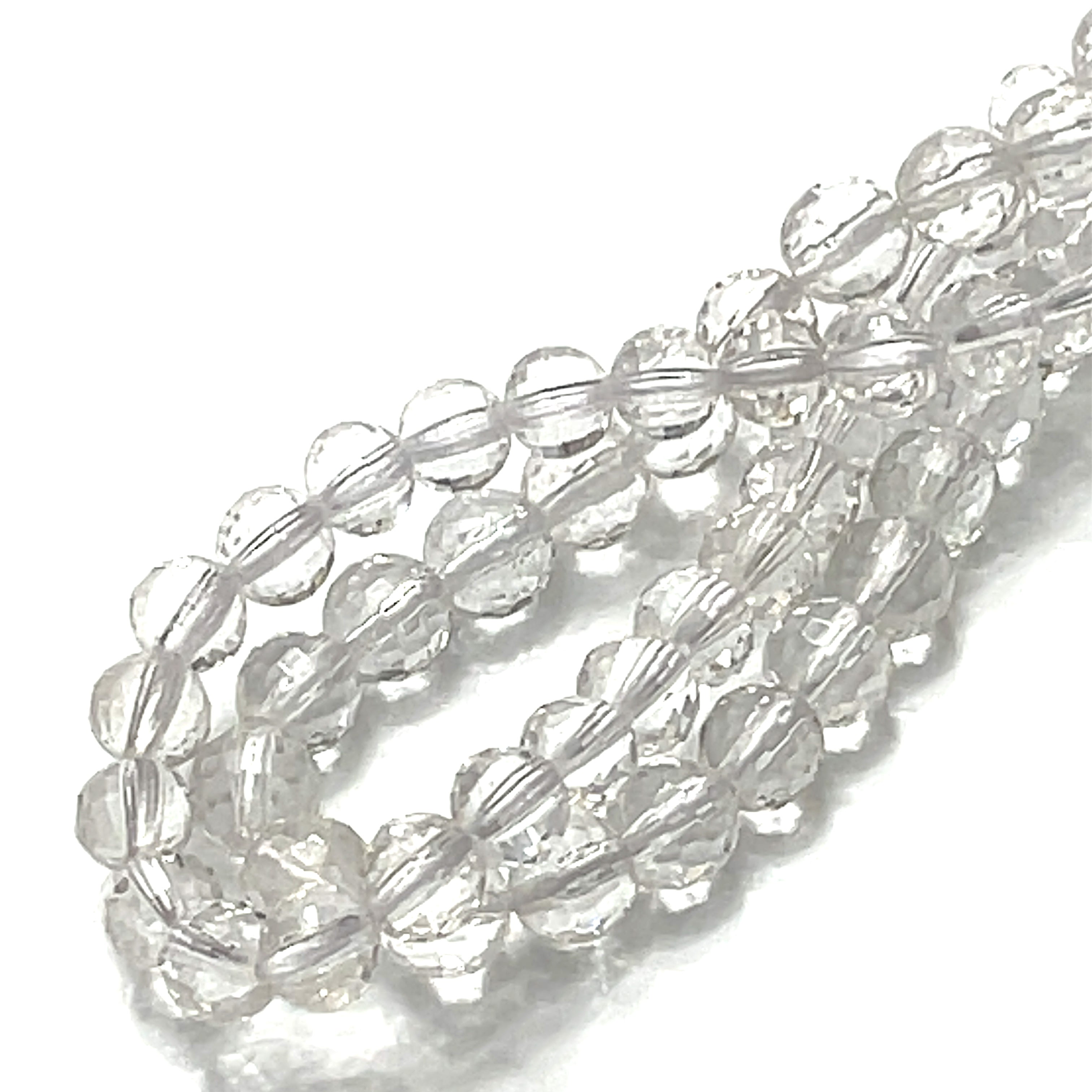 8mm Clear Quartz gemstone faceted cur rounds strand on a white background, overview. 