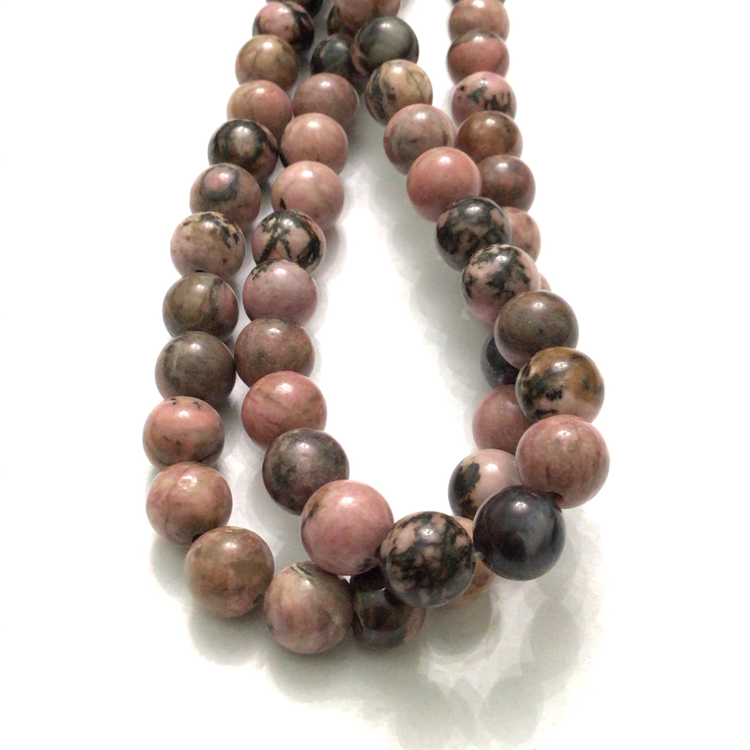 8mm Rhodonite smooth round gemstone strands, front overview. 