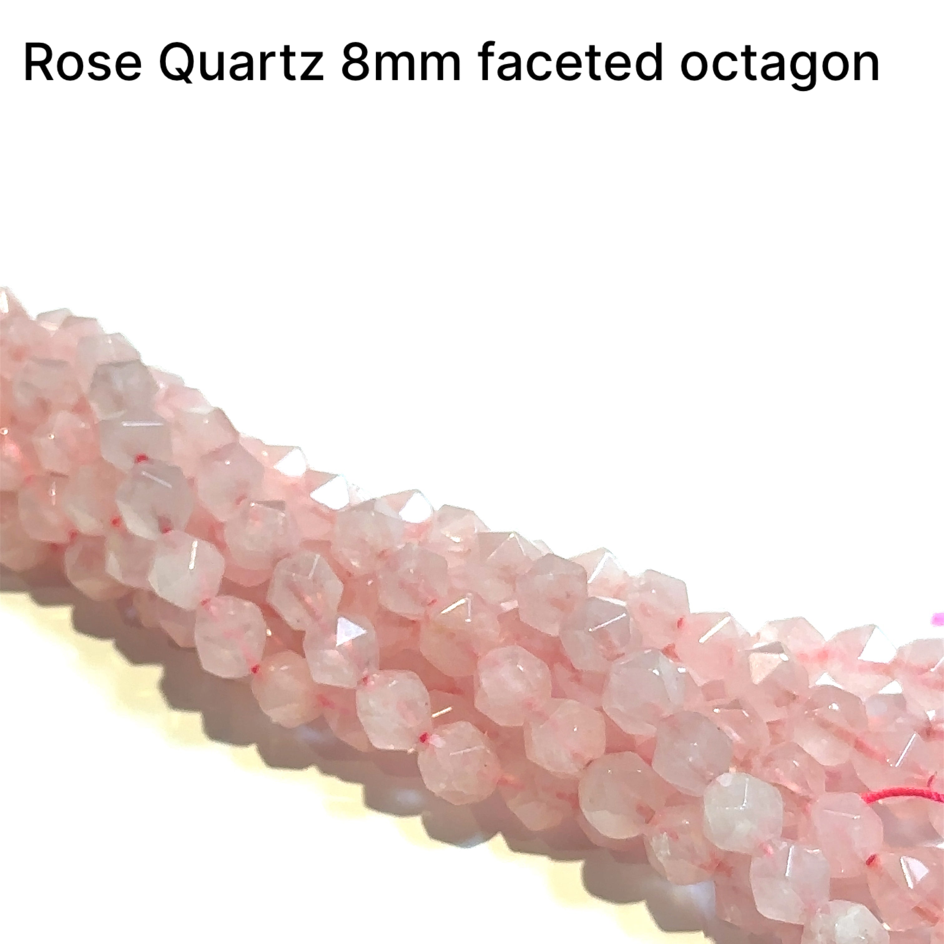 8mm  Rose Quartz gemstone beads, faceted octagons, 16'' strand on a white background, front overview.