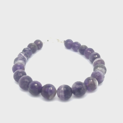 A Close-up view of polished Amegreen gemstone beads in soft lavender and green tones, handcrafted healing bracelet front overview video.