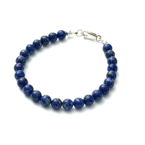 A Blue Kyanite beaded gemstone bracelet with a sterling silver lobster claw clasp. On a white background, front overview.