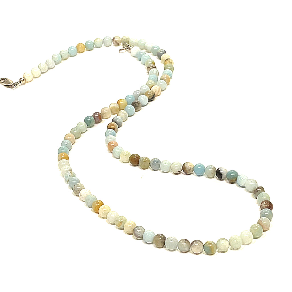 A Burma Jade gemstone beaded necklace with a silver lobster claw closure, displayed on a white background, long, front overview. 