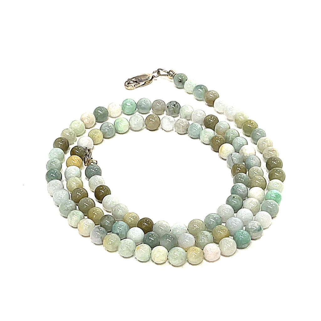 A Burma Jade gemstone beaded necklace with a silver lobster claw closure, displayed on a white background, spiral, front overview. 