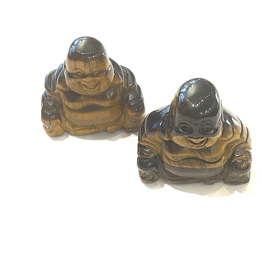 A Close-up of Golden Tiger Eye  of a Reiki infused gemstone Buddha with detailed carving on a white background front overview. 