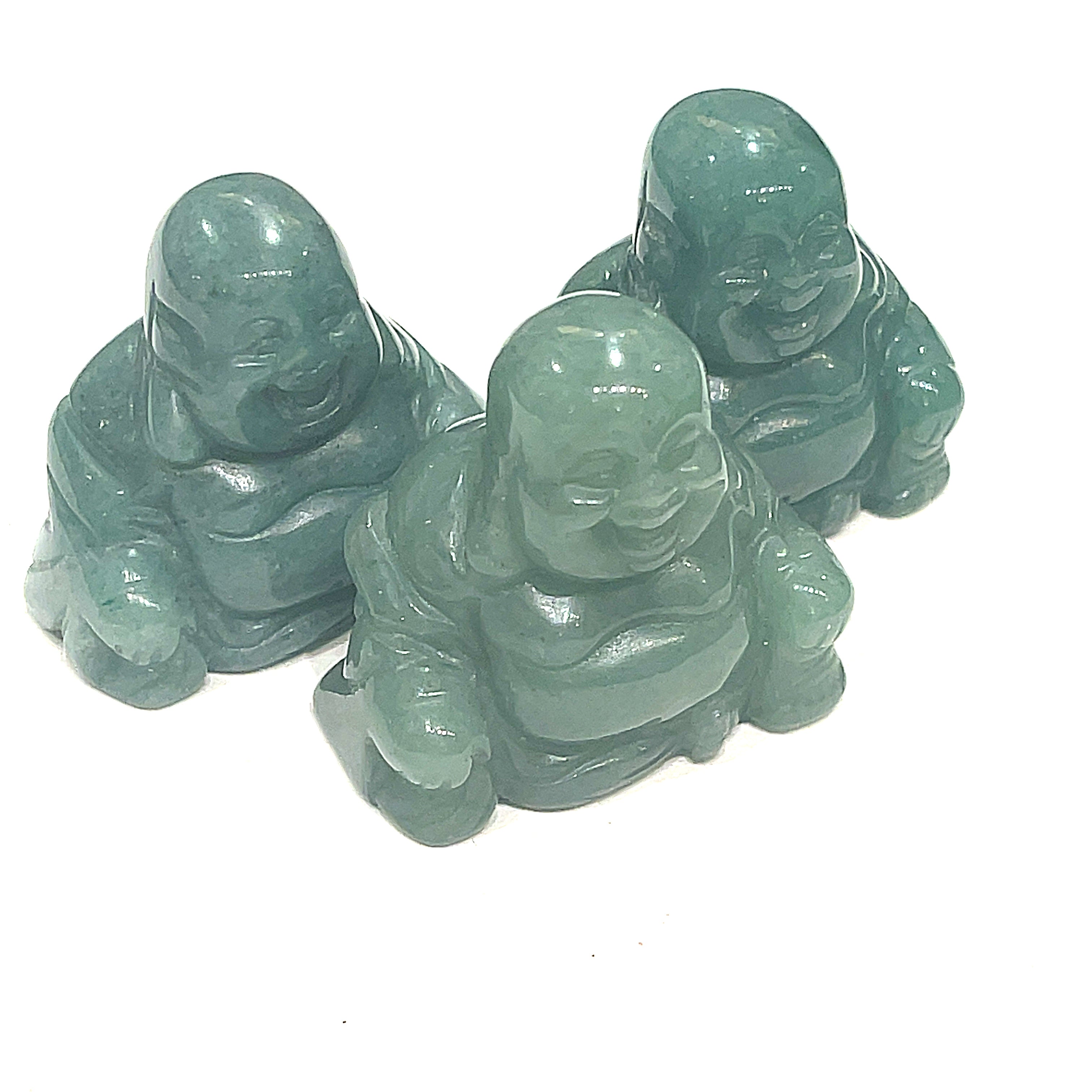 A Close-up of Green Aventurine Reiki infused gemstone Buddha with detailed carving on a white background front overview. 