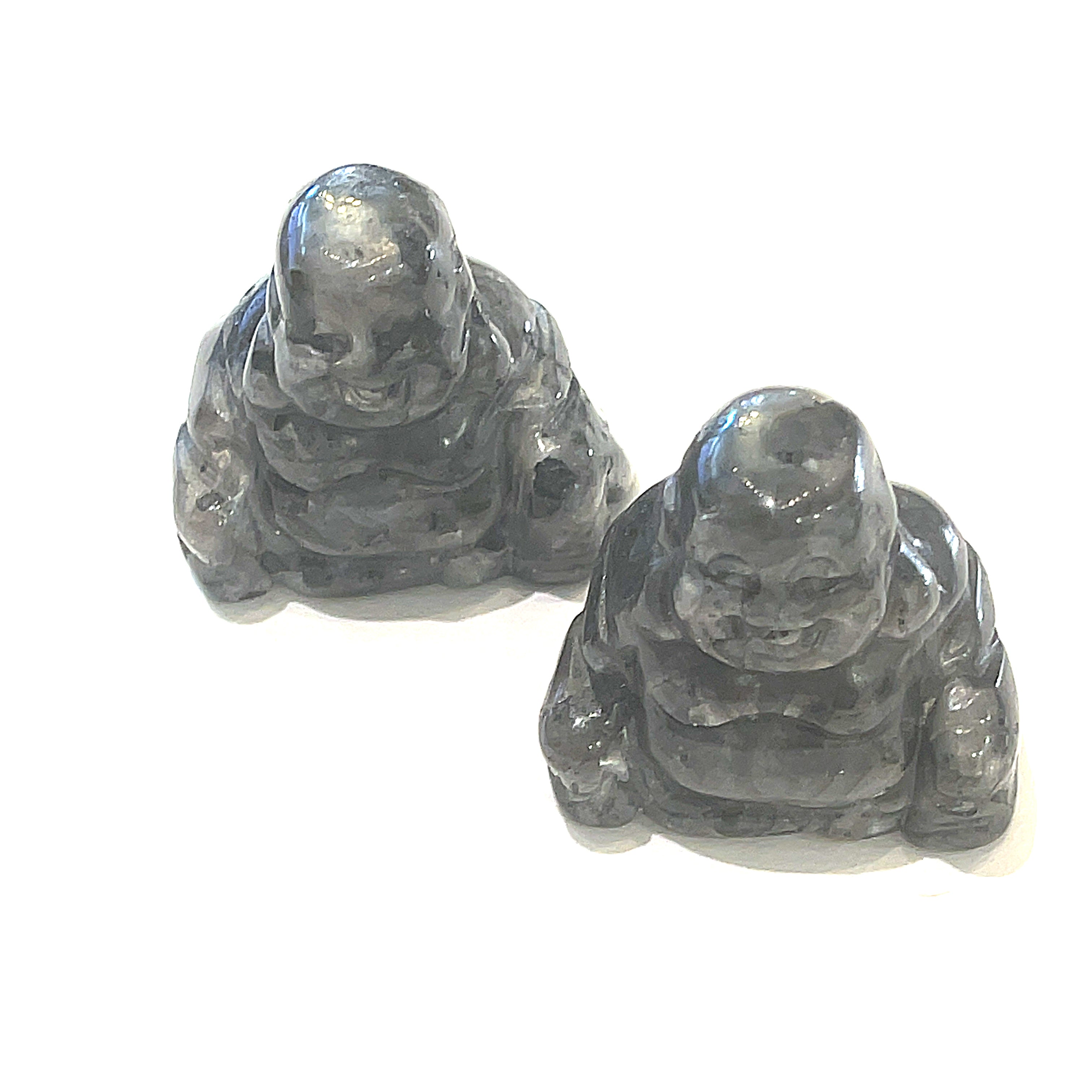 A Close-up of Labradorite of a Reiki infused gemstone Buddha with detailed carving on a white background front overview. 