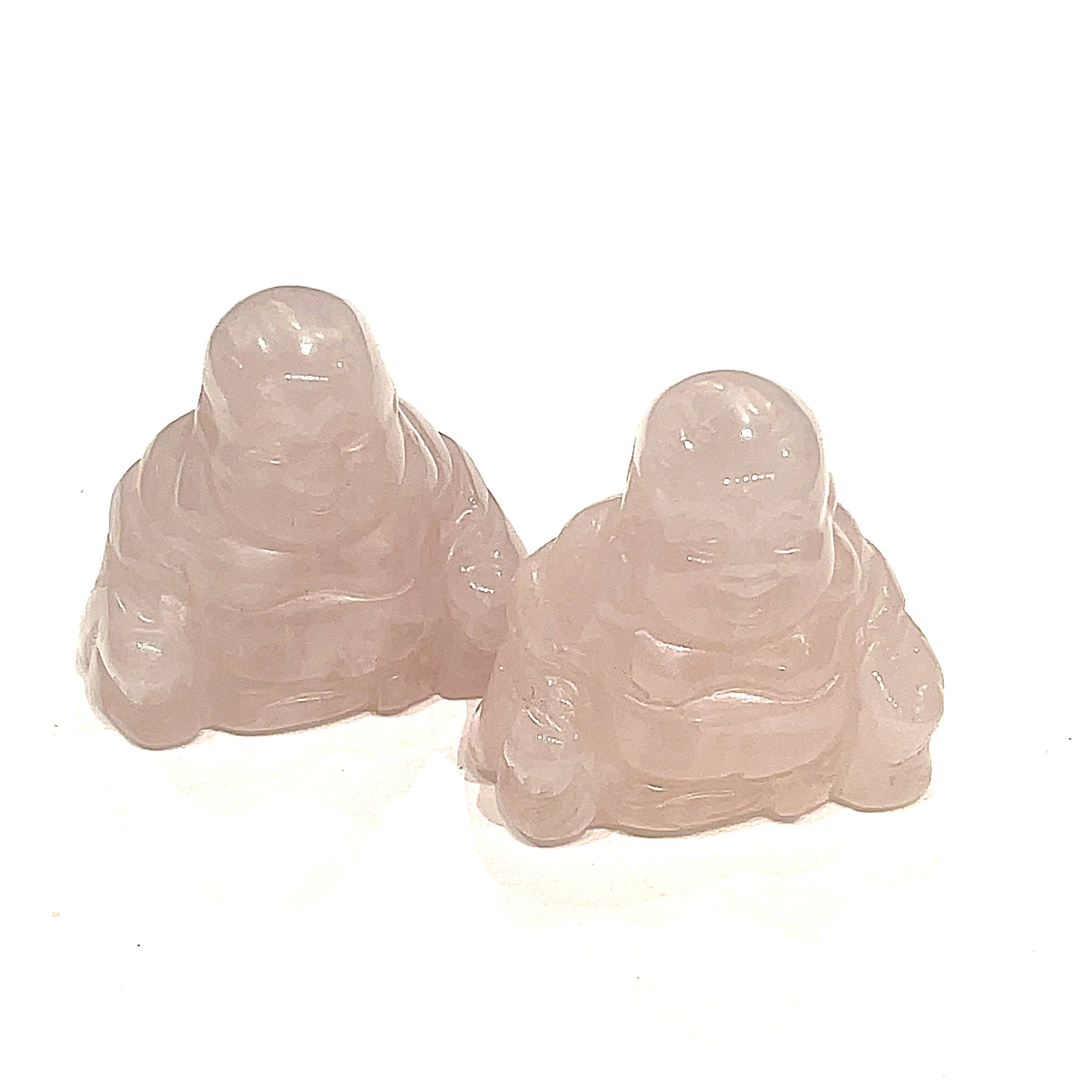 A Close-up of Rose Quartz Reiki infused gemstone Buddha with detailed carving on a white background front overview. 