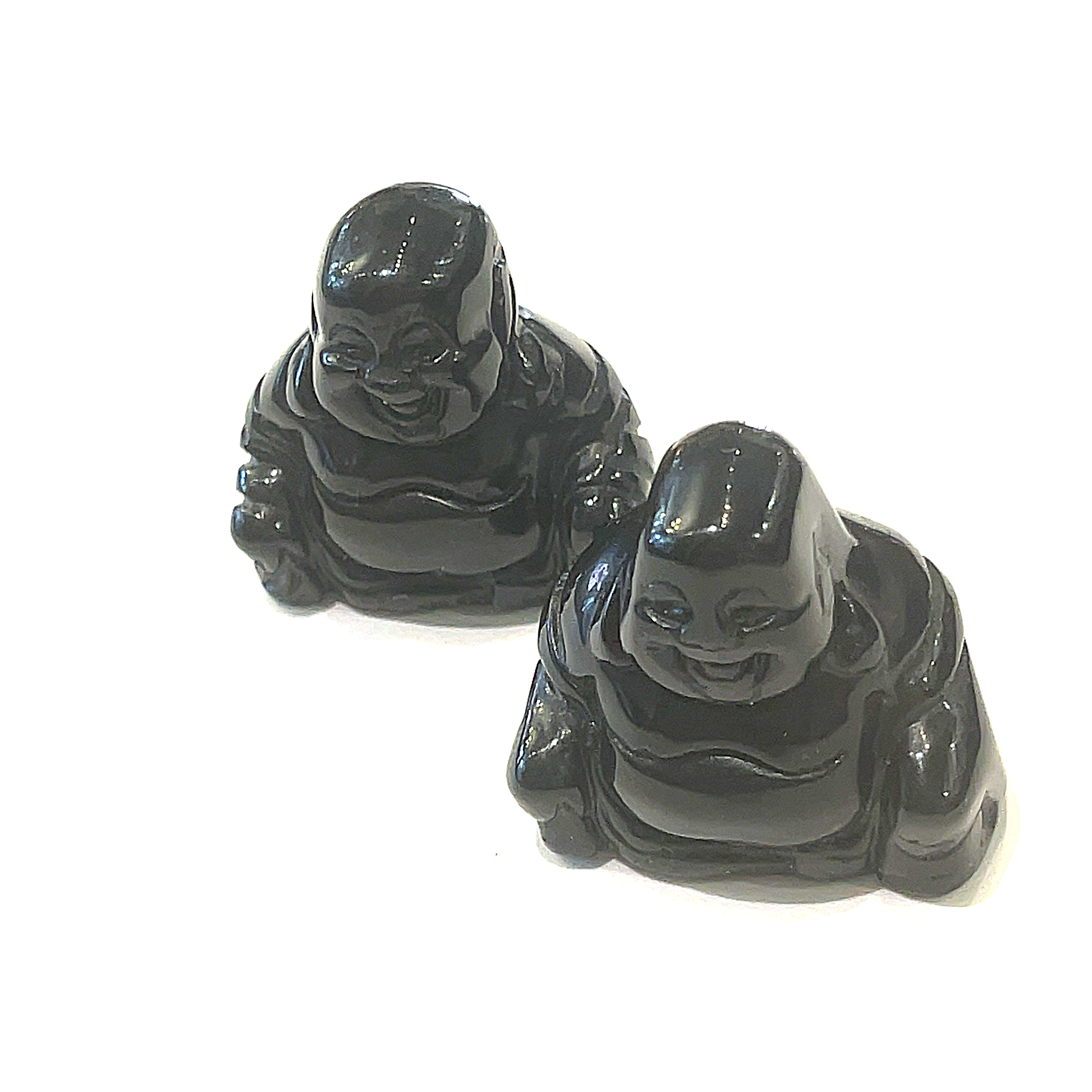 A Close-up of black obsidian of a Reiki infused gemstone Buddha with detailed carving on a white background front overview