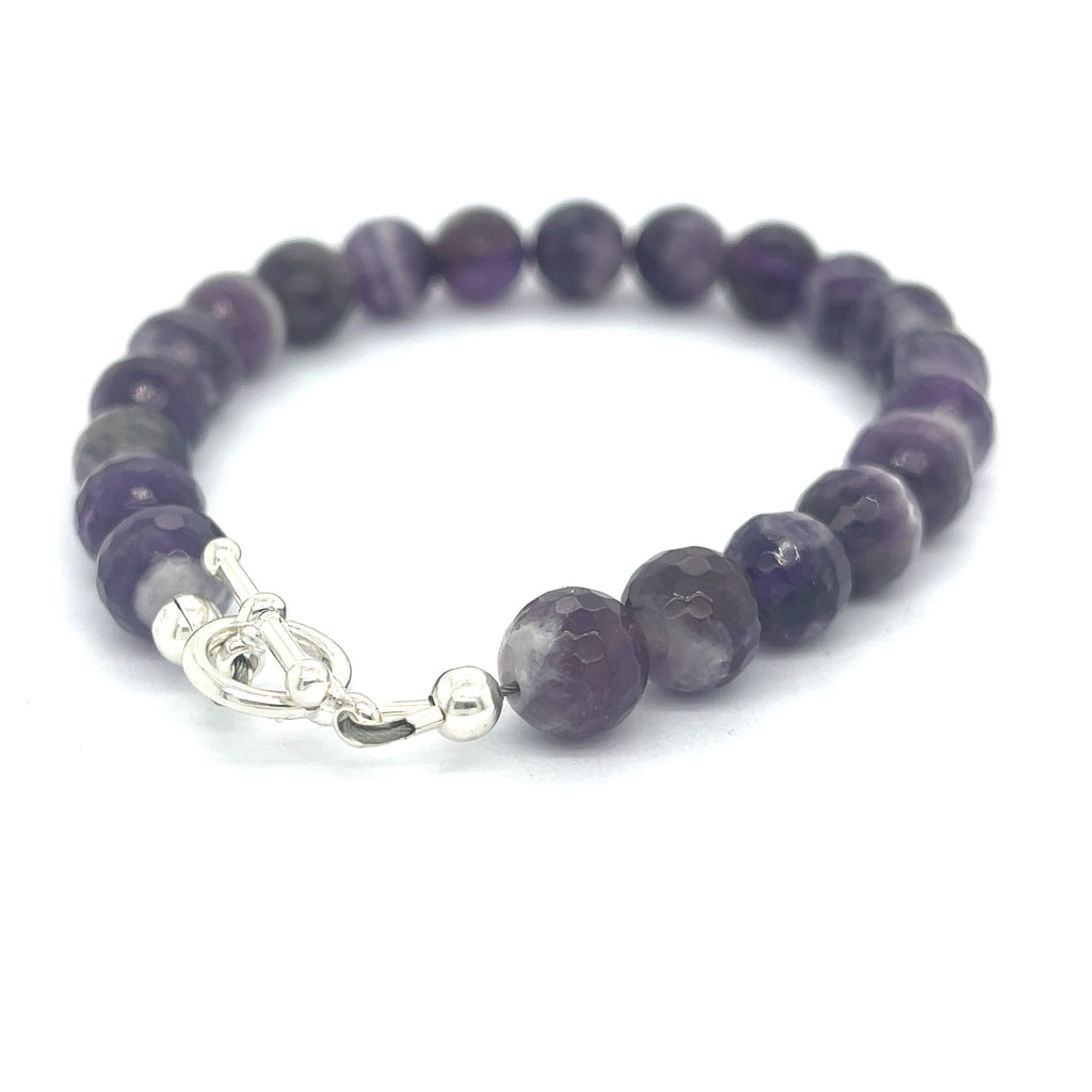 A Close-up view of polished Amegreen gemstone beads in soft lavender and green tones, handcrafted healing bracelet back overview.