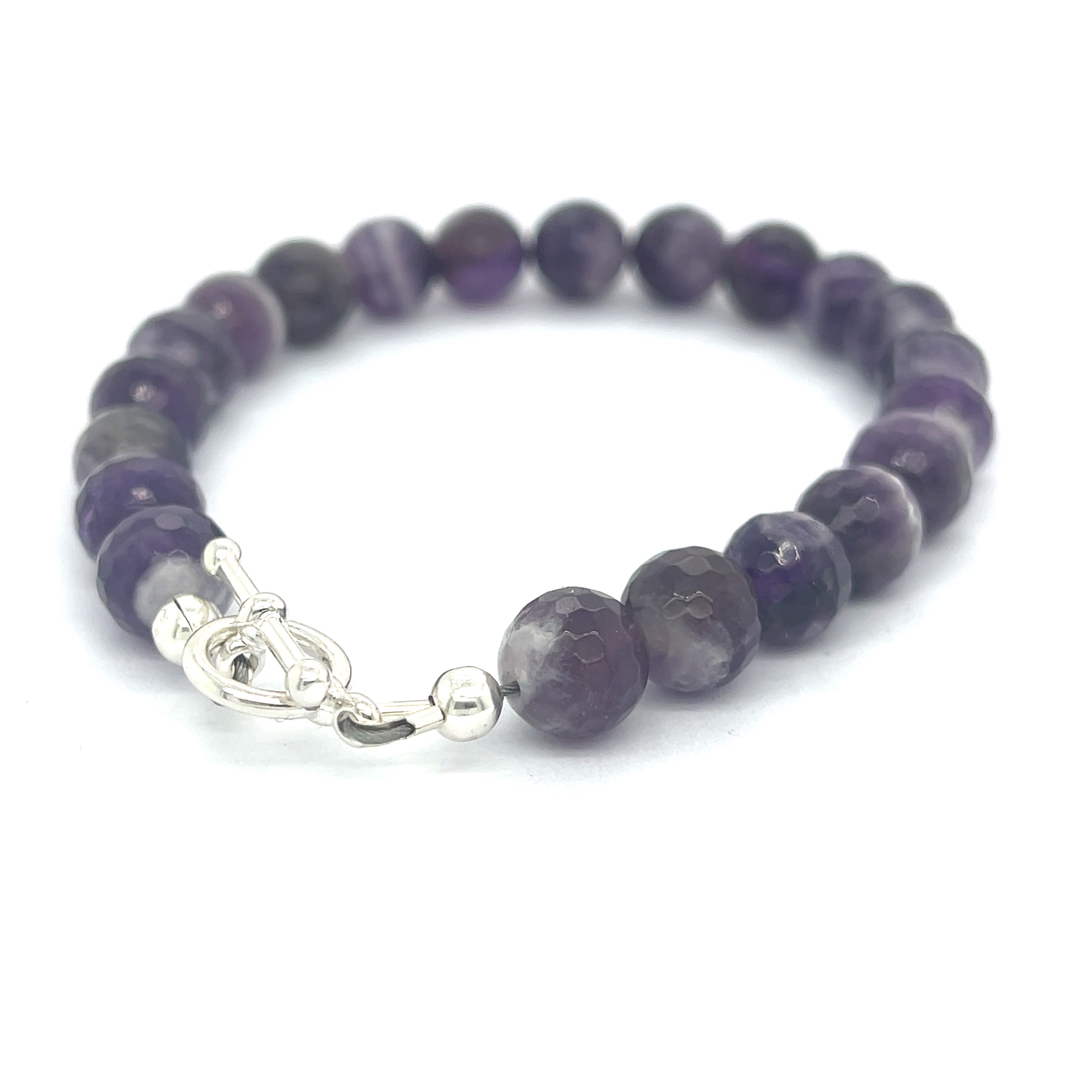 A Close-up view of polished Amegreen gemstone beads in soft lavender and green tones, handcrafted healing bracelet back overview.