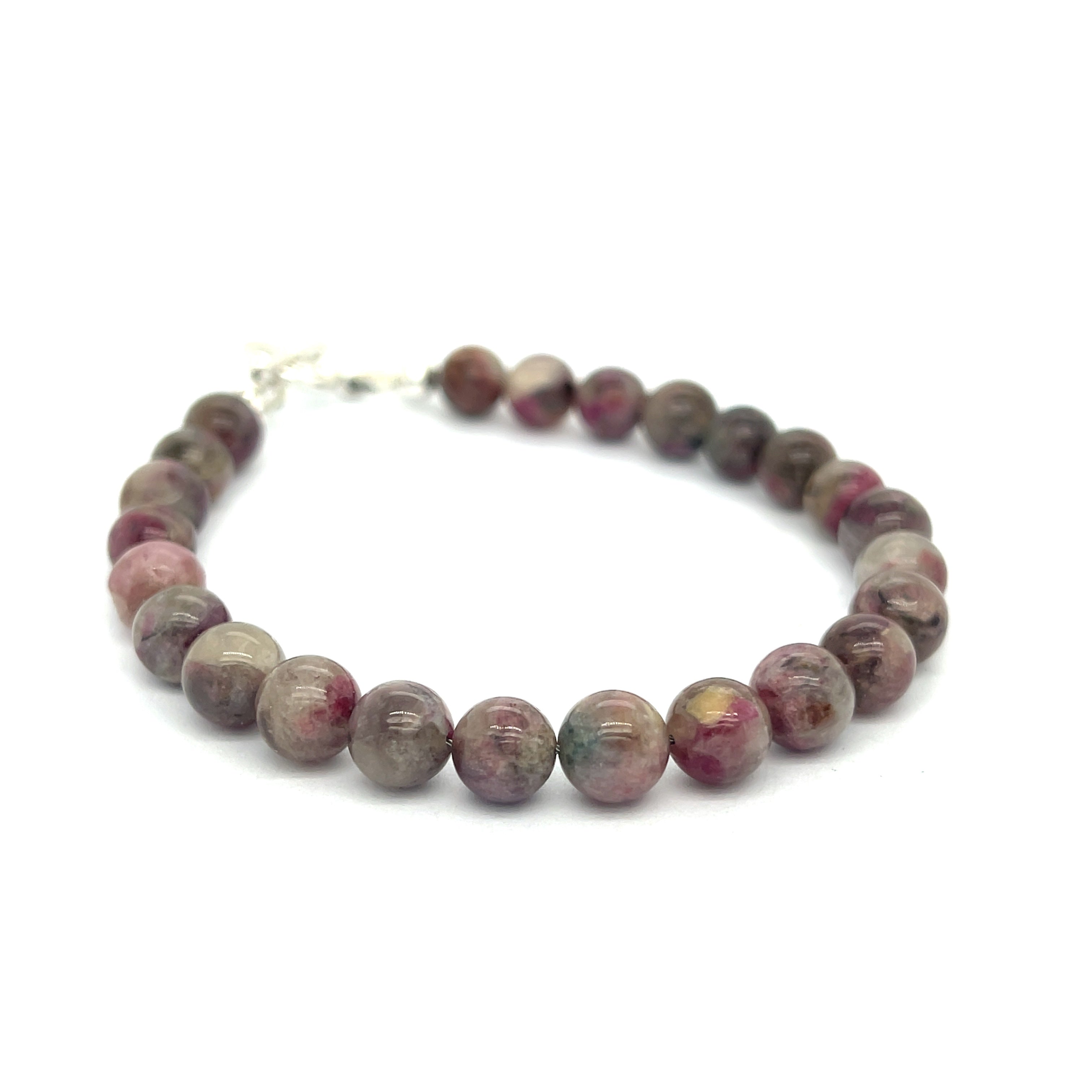 A Eudialyte gemstone beaded bracelet with a sterling silver toggle on a white background front center overview.