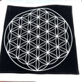 A Flower of Life 12x12 black velvet mat with white embroidery on a white background overview.  