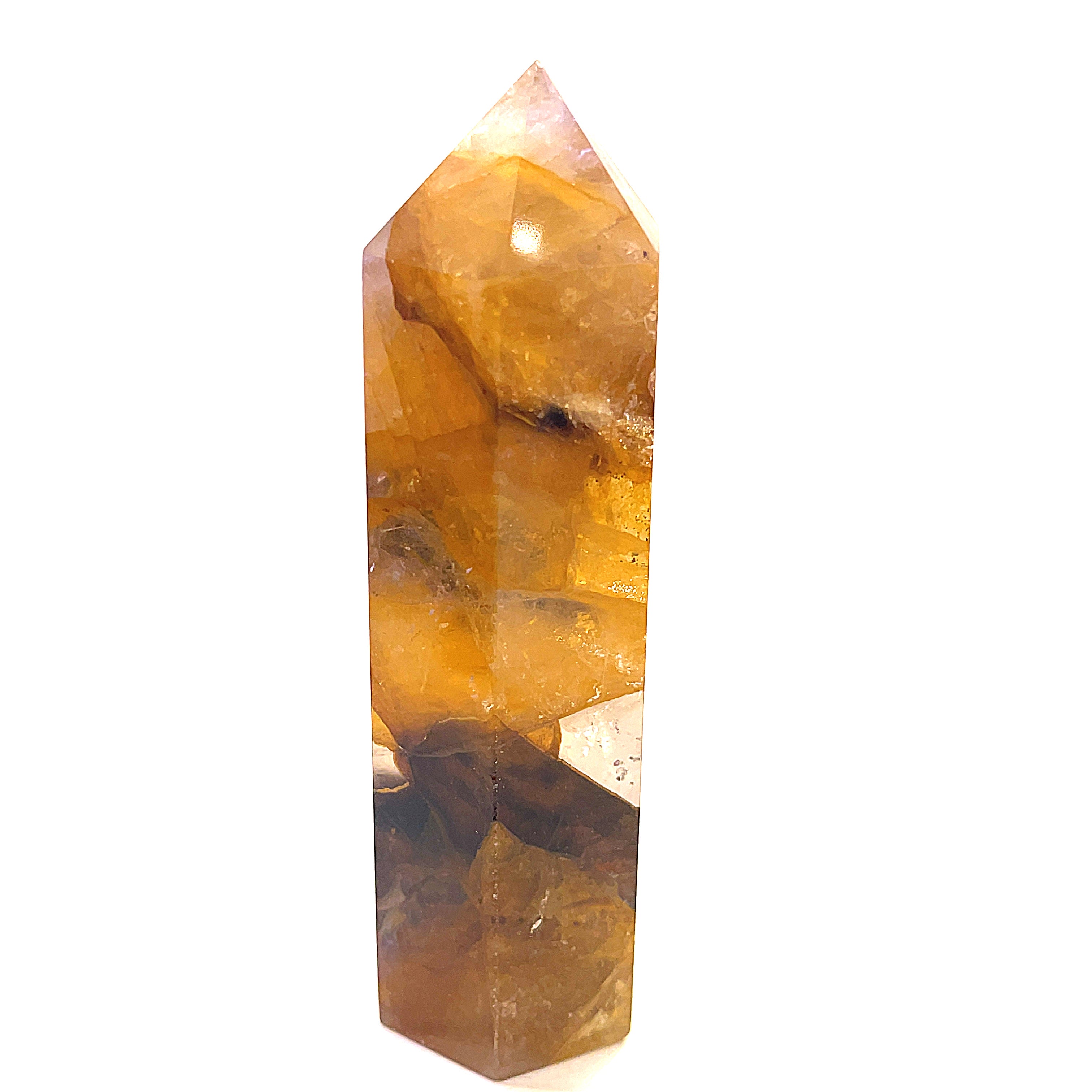 A Golden Healer Quartz gemstone towers displayed together on a white background front overview. 