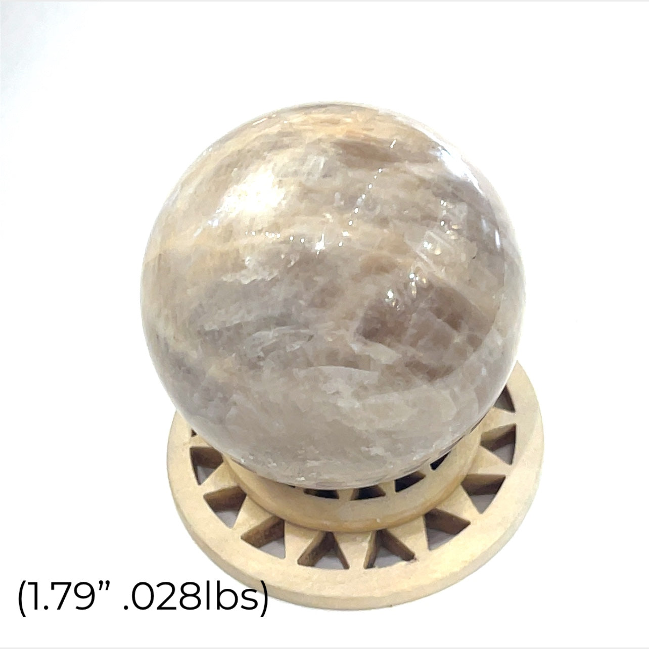 A Grey Moonstone Sphere for meditation, balance, and chakra work (1.79''/.028 lbs.)on a white background a close up view. 