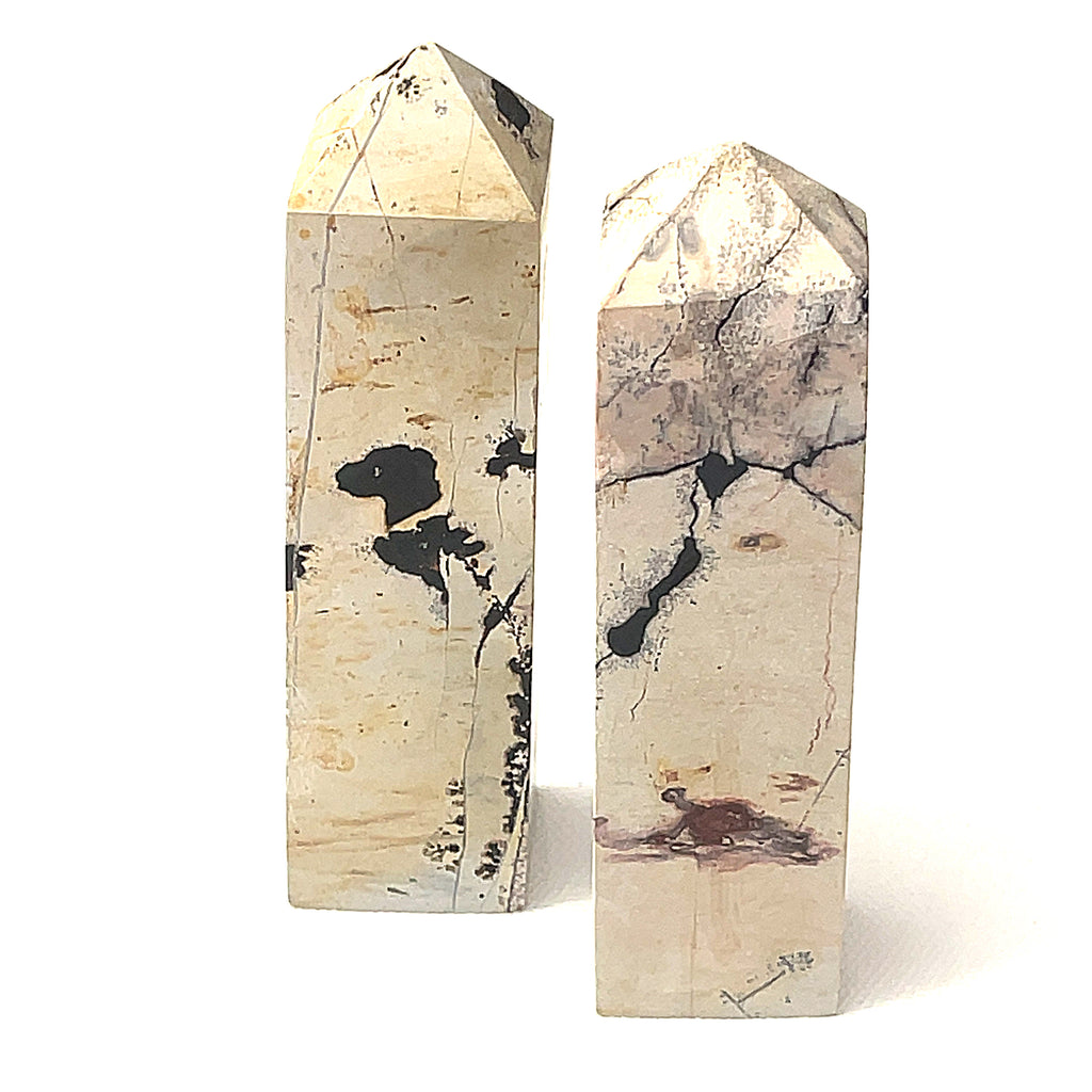 A Picture Jasper gemstone tower  on a white background, front view.