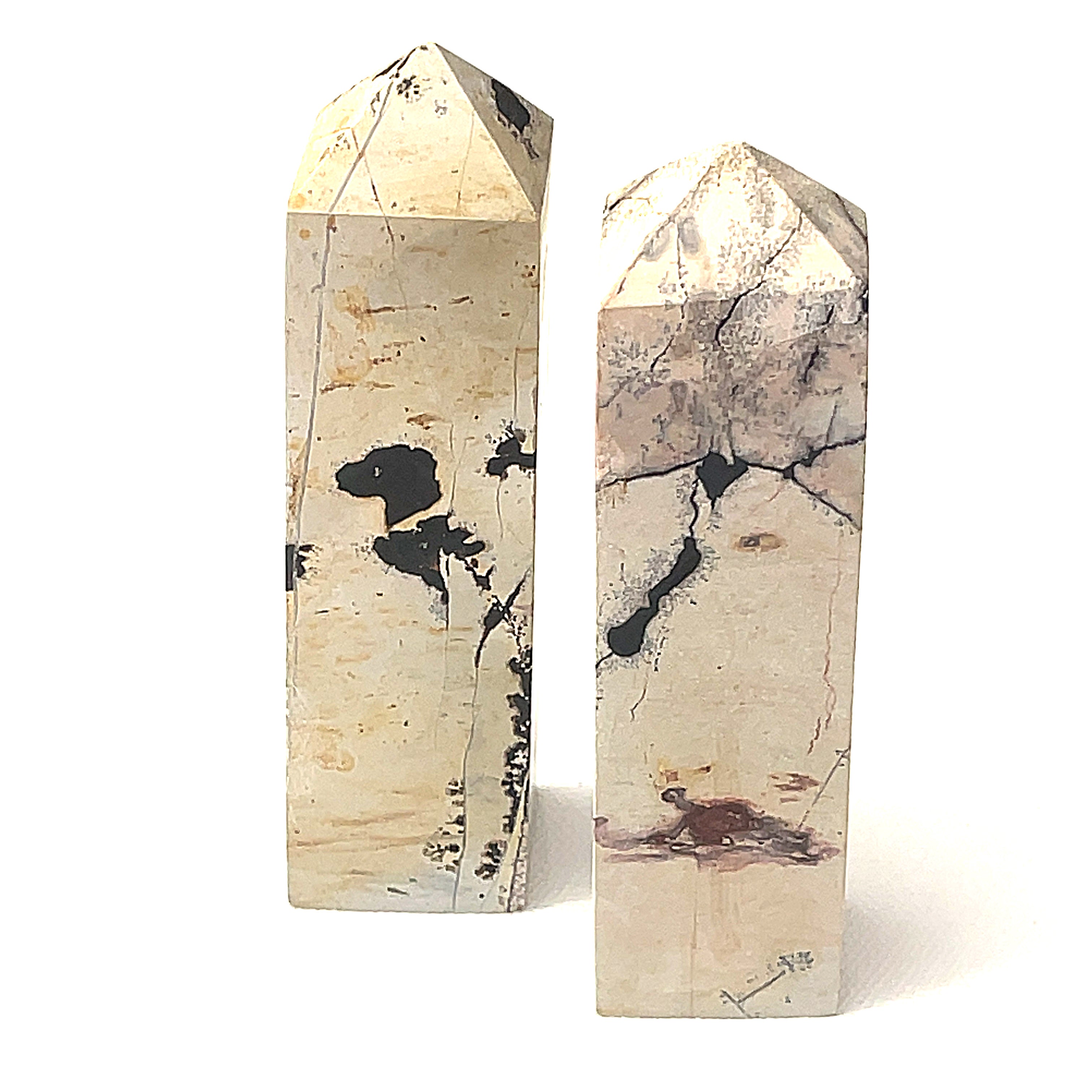 A Picture Jasper gemstone tower  on a white background, front view.