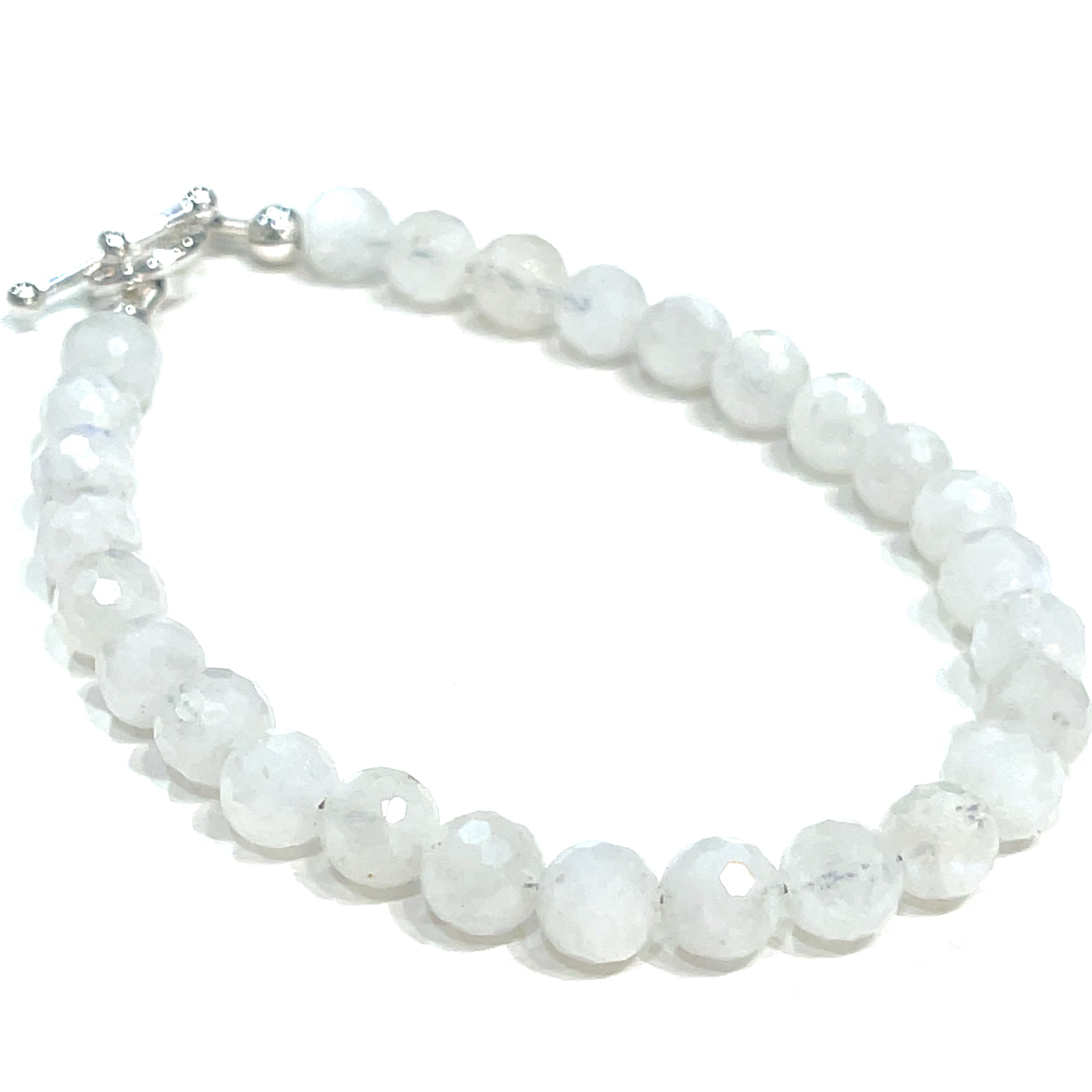 A Rainbow Moonstone beaded bracelet with a sterling silver toggle on a white background front close up overview. 