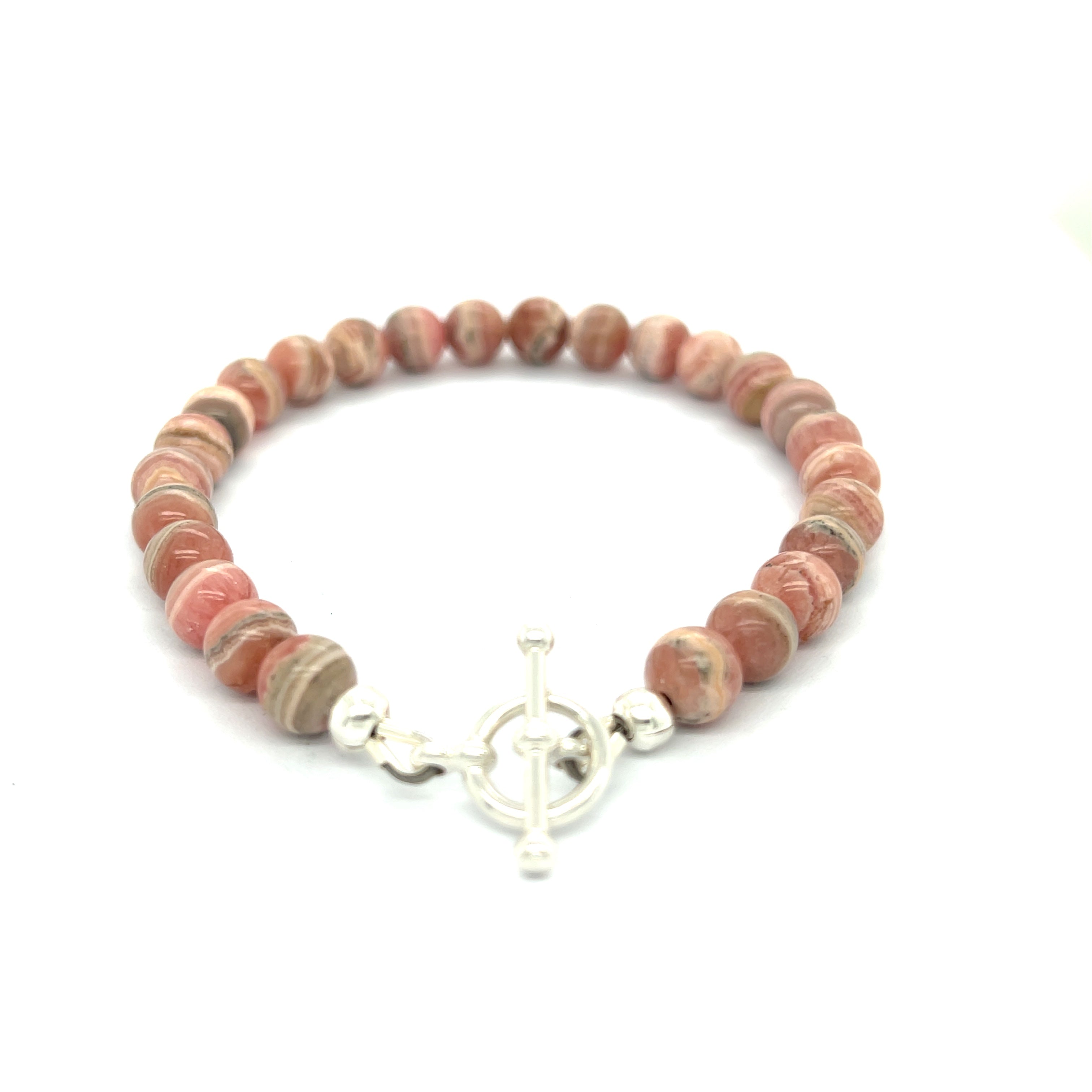 A Rhodochrosite Gemstone 6mm roundel beaded bracelet with a sterling silver toggle, on a white background, back overview.