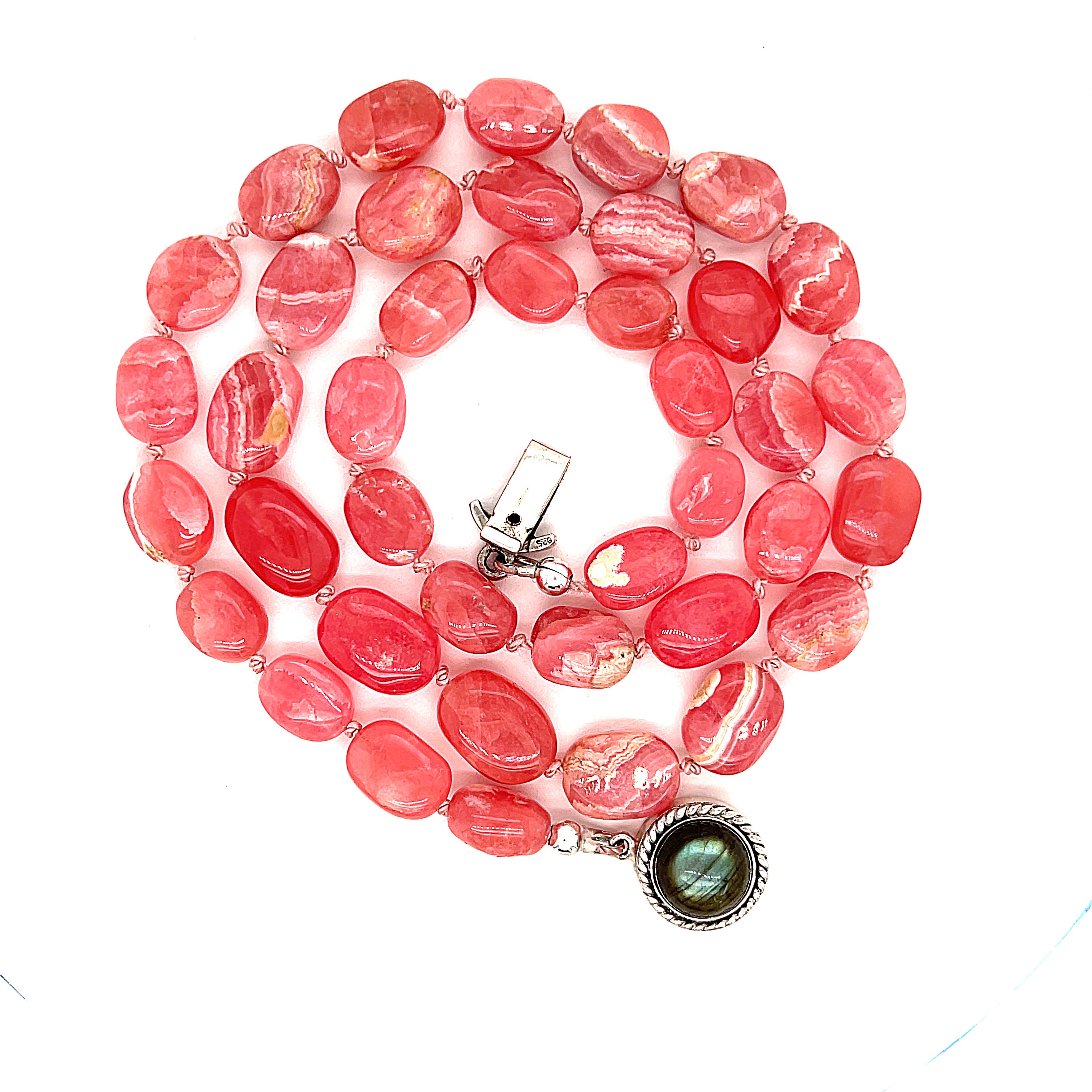 A Rhodochrosite gemstone knotted necklace with a sterling silver Labradorite gemstone box clasp, on a white background, back - claps, spiral close up overview.