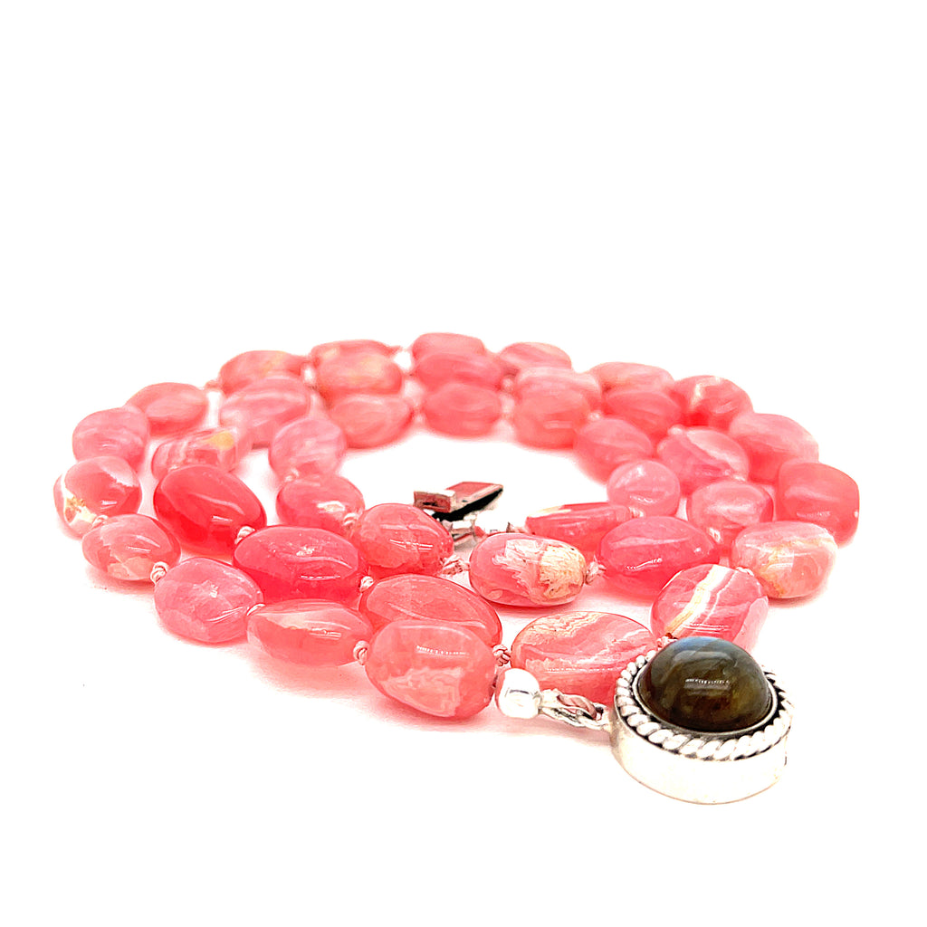 A Rhodochrosite gemstone knotted necklace with a sterling silver Labradorite gemstone box clasp, on a white background, back - claps, spiral overview.