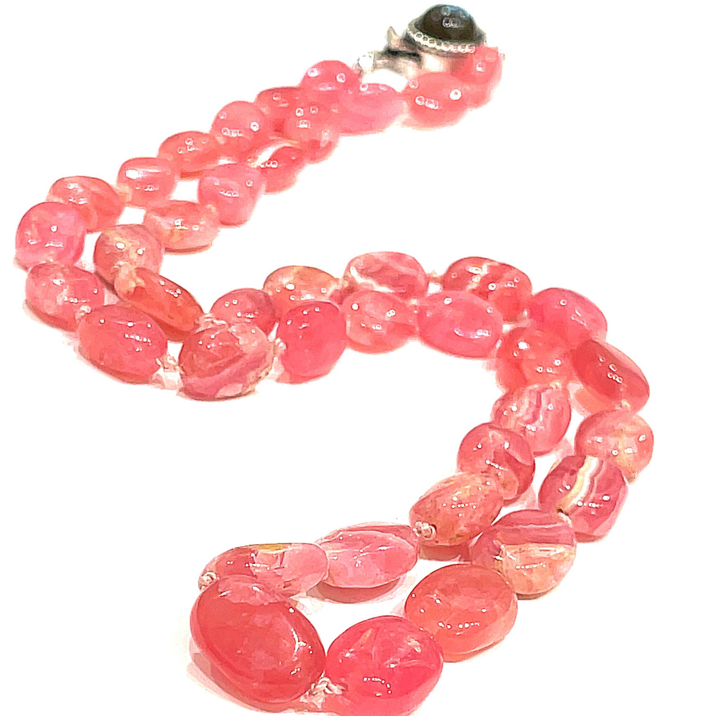 A Rhodochrosite gemstone knotted necklace with a sterling silver Labradorite gemstone box clasp, on a white background, front, long close up overview.