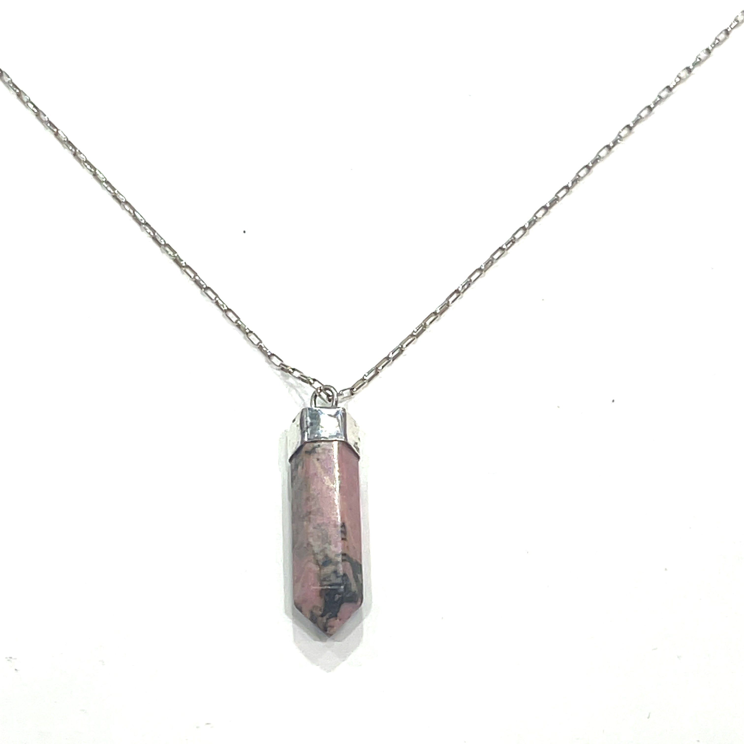 A Rhodonite gemstone pendant on a sterling silver chain. On a white background  hung and center,  close up overview. 