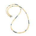 A Shell roundel gemstone necklace with sterling silver tribal tube beads on a white background, front long overview.