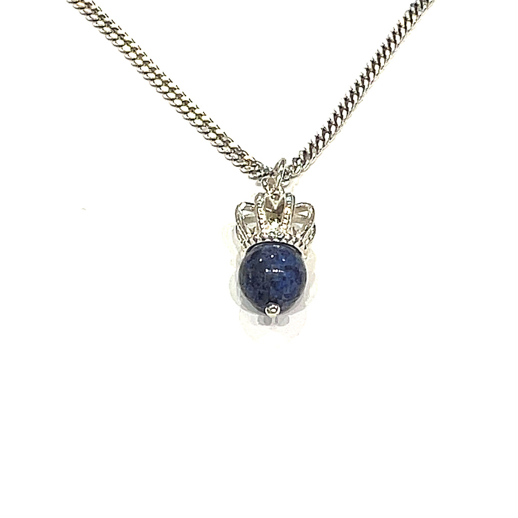 A Sterling Silver Crown Pendant with lapis lazuli gemstone on a white background, long hanging overview. 