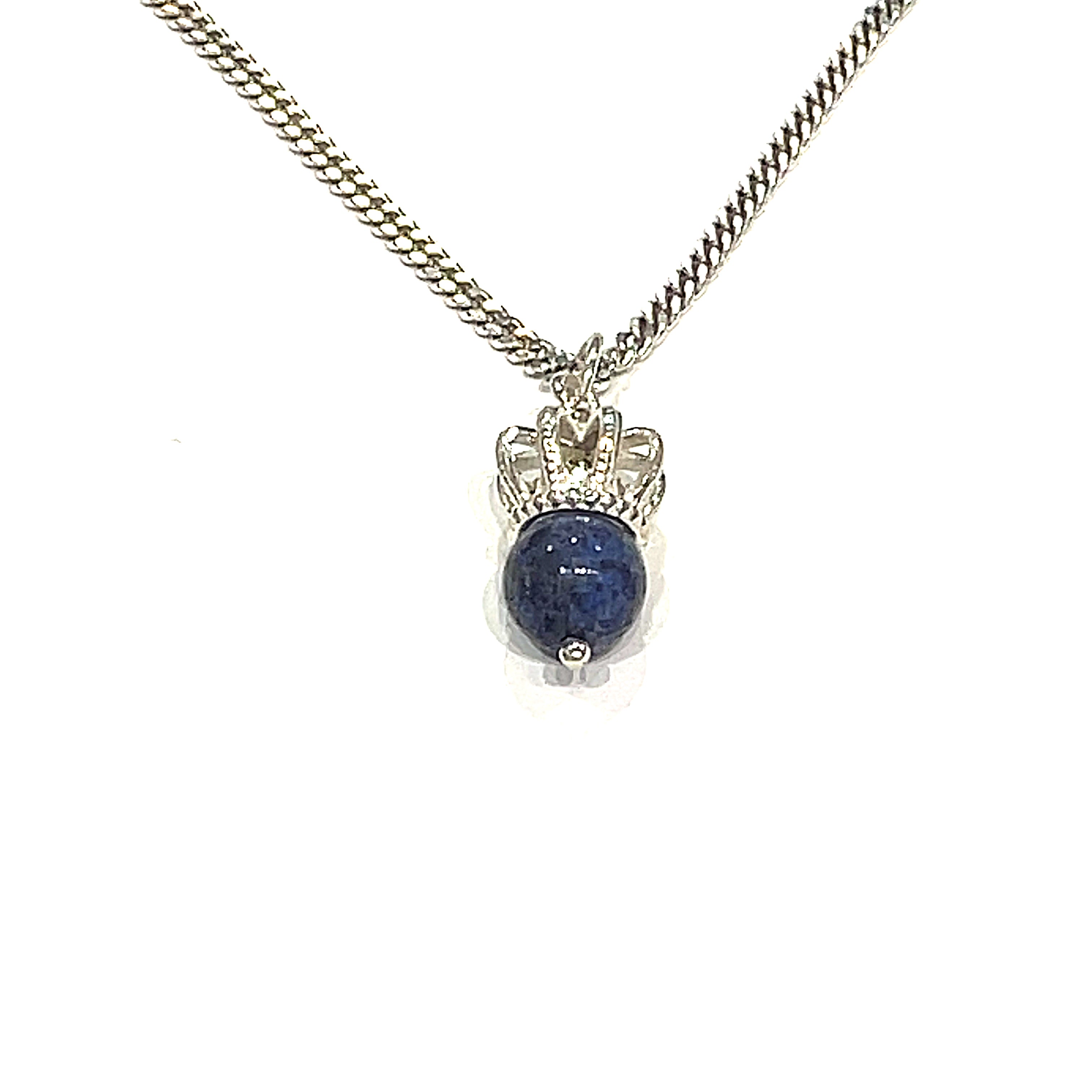 A Sterling Silver Crown Pendant with lapis lazuli gemstone on a white background, long hanging overview. 