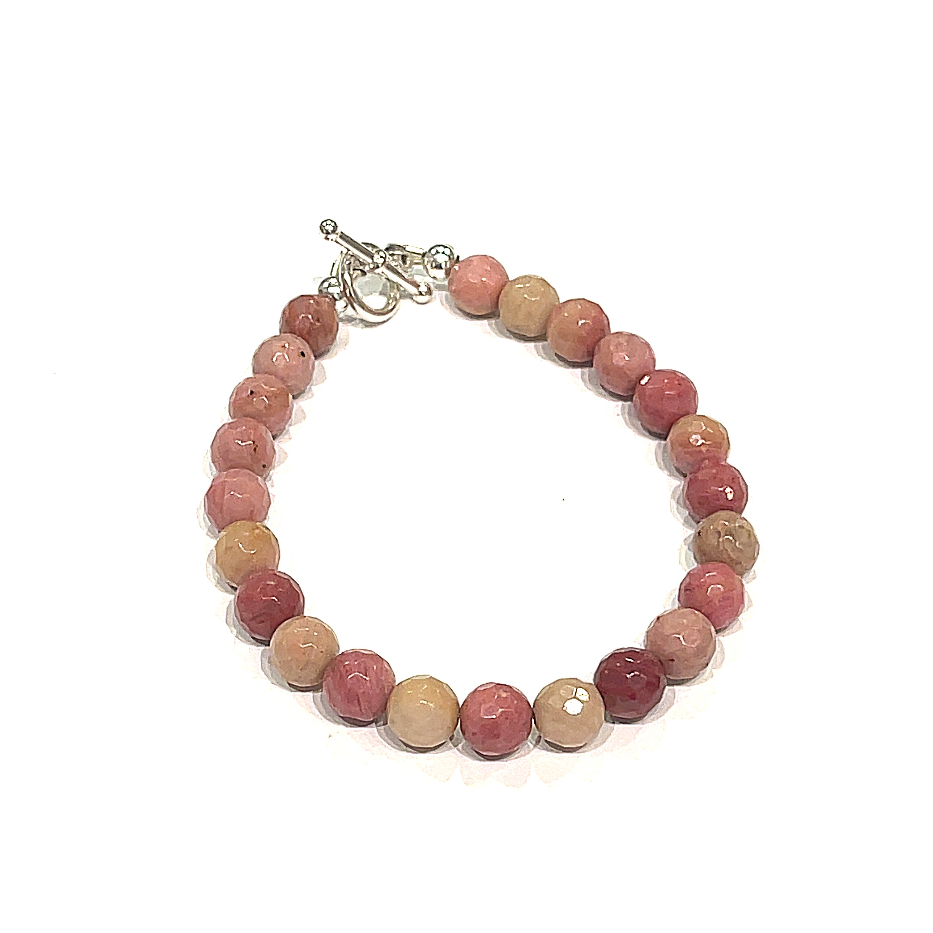 A Thulite gemstone bracelets with Sterling Silver findings and a Sterling Silver toggle, displayed against a white background, front clpose up overview.
