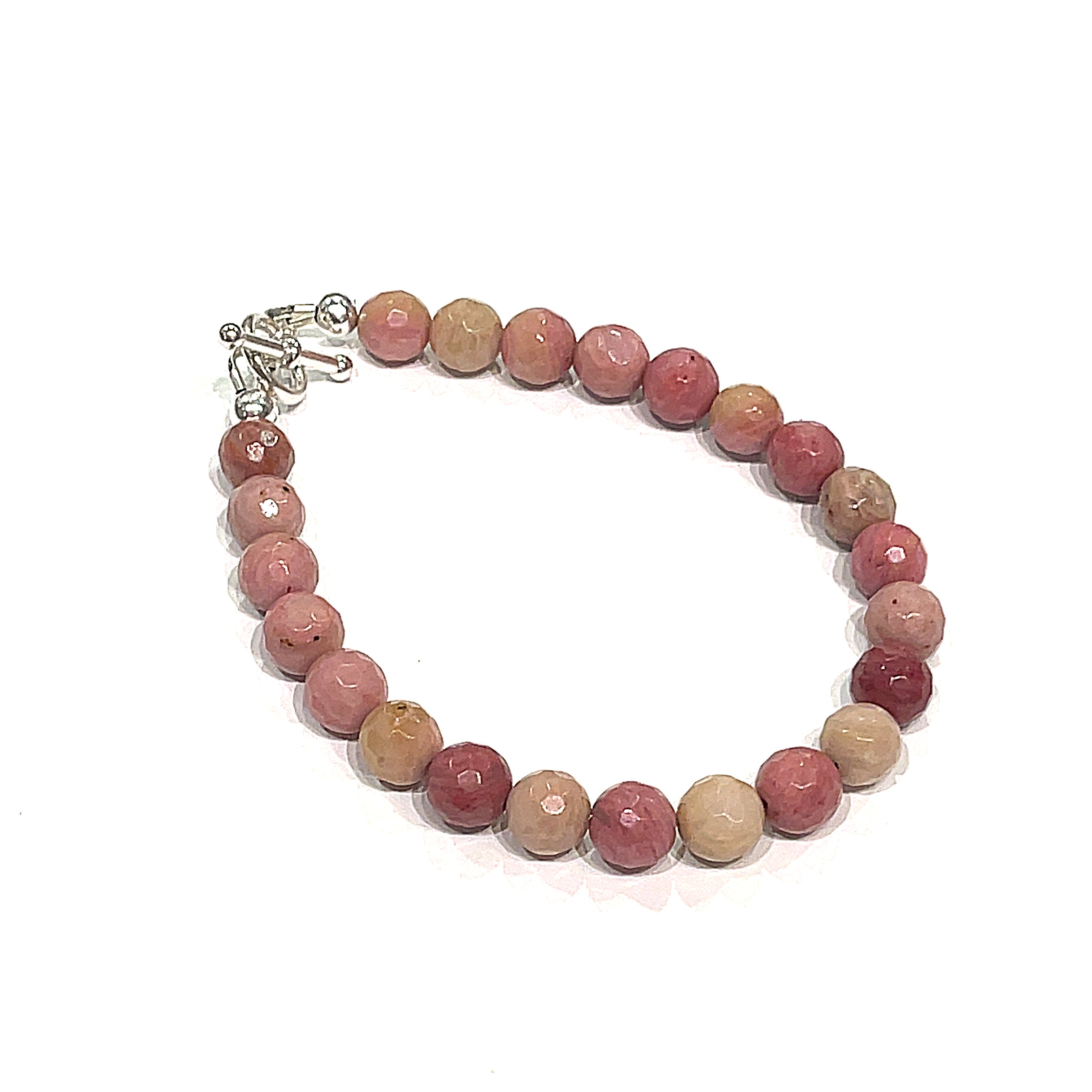 A Thulite gemstone bracelets with Sterling Silver findings and a Sterling Silver toggle, displayed against a white background, front overview.
