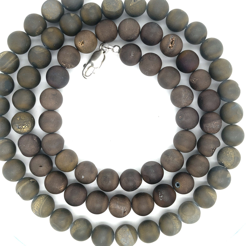A Unisex Druzy Agate Necklace styled for layering and everyday wear, on a white background, center-spiral, close up overview. 