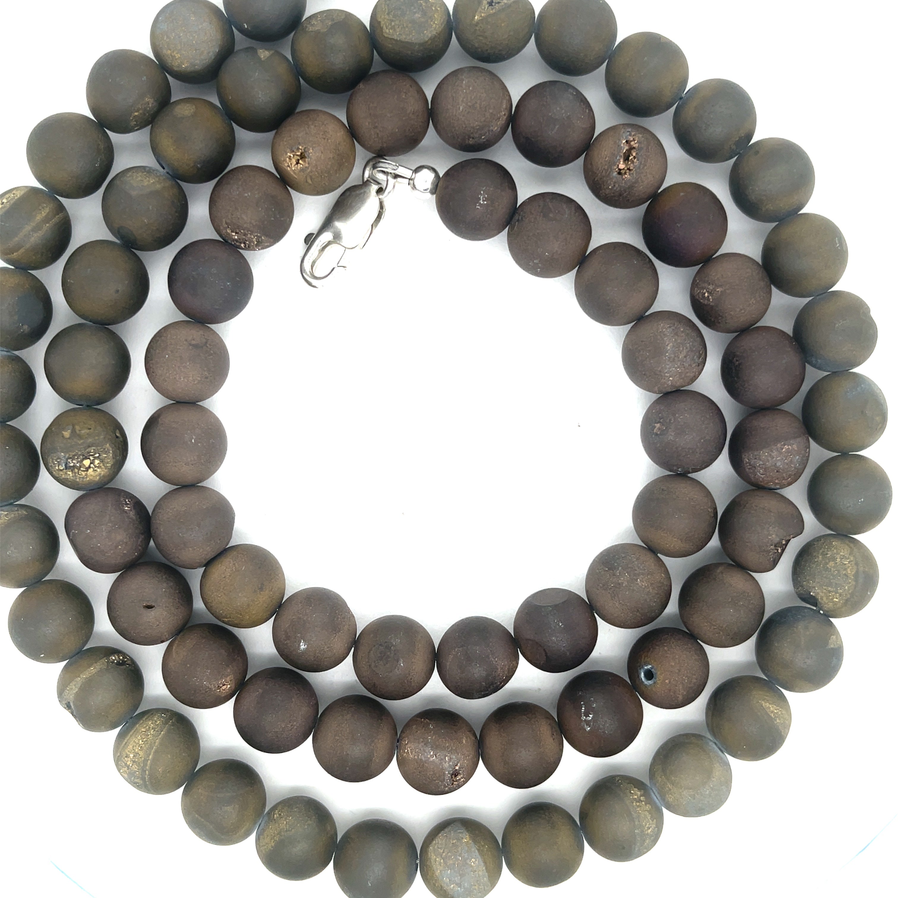 A Unisex Druzy Agate Necklace styled for layering and everyday wear, on a white background, center-spiral, close up overview. 